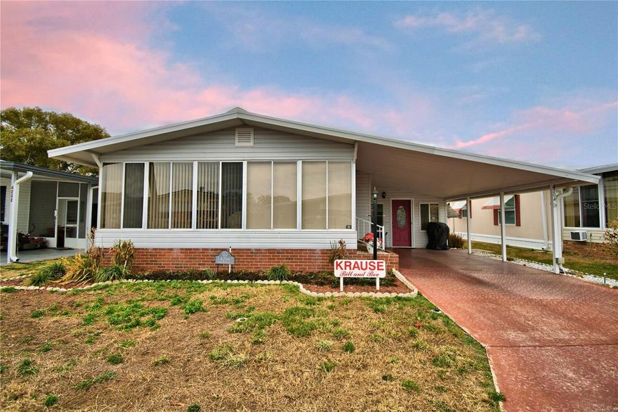 You must check out this beautiful home in Oakwood Estates, a 55+ community.  From the carport you walk into a family room, just perfect for entertaining.  Continue into the main living space to find a fully remodeled kitchen and dining area with a nice built in for added storage.  The living room has cathedral ceilings and nice laminate flooring.  Follow through the sliding door to another living space, just perfect to sit and watch the world go by.  The carpeted bedrooms are large enough to accommodate a king size bed.  The hall bath is equipped with a walk in tub.  The home features updated double pane windows throughout the main house.  The TPO roof was installed in September 2023 and the HVAC was installed in May 2024.  The front and side porch area are included in the square footage as they are conditioned with the central HVAC.  If that is not enough, the home comes mostly furnished, plus the golf cart, and a generator.  Oakwood Estates is a very active senior community offering many amenities and activities.  You can be as involved as you want or just sit back and enjoy the peaceful setting.