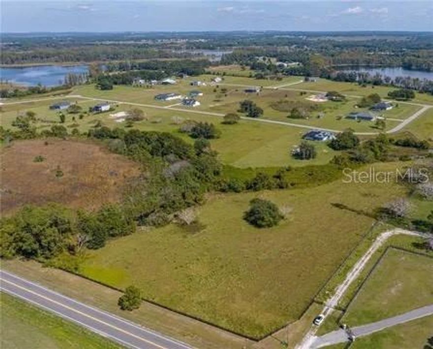 Nearly 5 Acres-This almost 5-acres tract is fully fenced and located in Pretty Lake Ranch-one of the few parcels situated outside the gated portion of the community, offering added flexibility and accessibility. Underground electric is already available, and well will be installed.  The land is ideal for variety of uses, including farm animals, agricultural planting, or your private retreat. A rare find with room to grow, live and enjoy wide-open space!