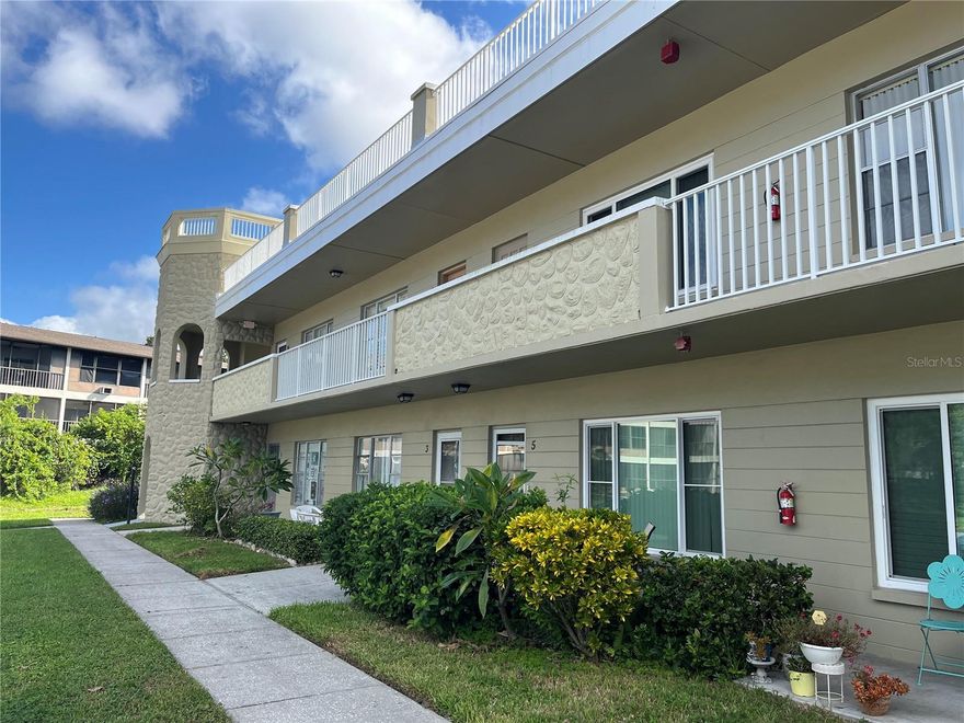 This first floor unit has been updated with an open kitchen, newer cabinets and large counter top for family gatherings. Ceramic tile thru out extending all the way to the very private back patio backing up to the nature preserve. Come and enjoy this comfortable, well kept and furnished home. Assigned parking. The 55+ community has two activity centers, and two private golf courses with 9 and 18 holes, free exclusively for resident owners. There are two heated swimming pools.  The remodeled Cardio Gym has the latest exercise equipment. A very pet-friendly community, there is a fenced dog park with covered seating. There are hobby studios, and a wood shop for the exclusive use of the residents. Activities include fitness classes, dancing, clubs, cards, billiards, entertainment, classes, and much more. The on-site Good Karma Café has take & bake meals and snacks. Close to beaches, transportation, shopping, entertainment, and fine dining. All room sizes, floor plans and square footage are approximate. This property is being transferred by a leasehold estate deed. Association approval is required. If financing, a 35% down payment is required.