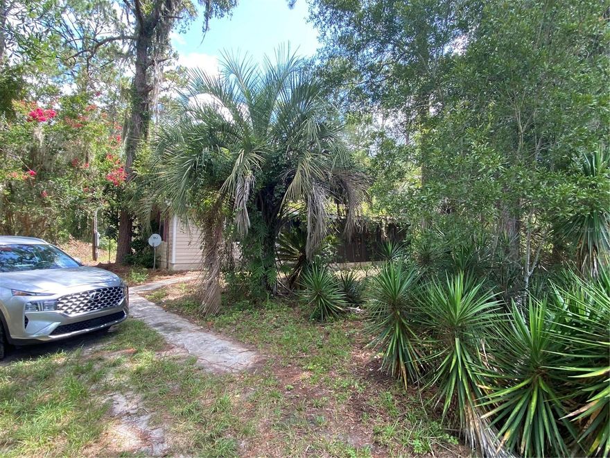 Two plus acres of privacy
Three bedroom two full bathroom frame built home with screened front porch.
Needs TLC
Roof less than 10 years old
AC less than 5 years old
Holding tank on well less than 2 years old
Home needs floor coverings.