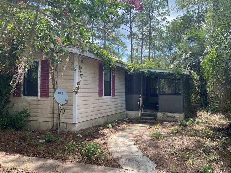 Two plus acres of privacy
Three bedroom two full bathroom frame built home with screened front porch.
Needs TLC
Roof less than 10 years old
AC less than 5 years old
Holding tank on well less than 2 years old
Home needs floor coverings.