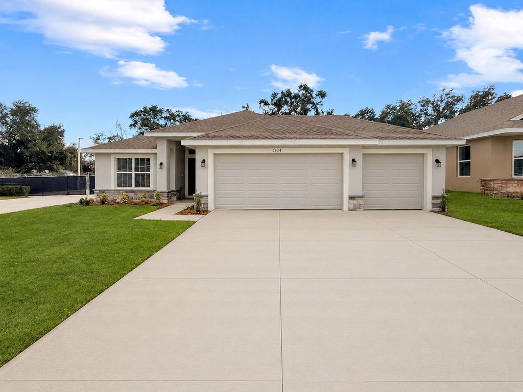Photo of 1654 Ann Rose Way, Leesburg, FL 34748 (MLS # O6422970)