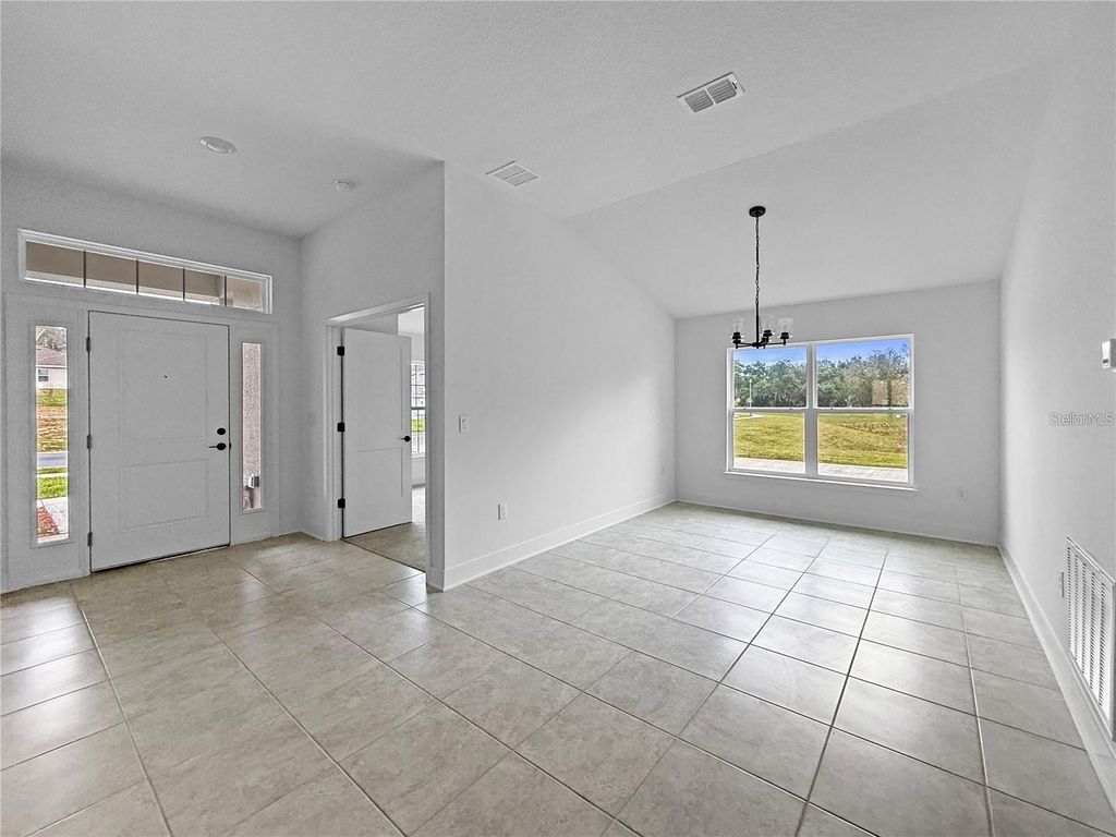 Photo of 1654 Ann Rose Way, Leesburg, FL 34748 (MLS # O6422970)