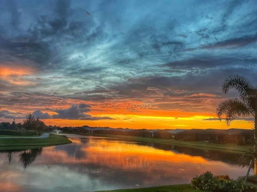 Long lake views. Sunset skies. One of the best lots in Cresswind. This 3-bedroom, 3-bath home with a den offers both comfort and peace of mind, built to current codes, not in a flood zone, with hurricane-impact windows and no storm damage in 2024. Inside, thoughtful upgrades elevate the space, including porcelain tile flooring, an expanded kitchen, tray ceilings, and an open, easy-flow layout designed for everyday living and entertaining. The screened lanai is where it all comes together, offering a peaceful place to unwind while taking in the shimmering lake and evening sunsets. Cresswind feels like an over-55 cruise ship on land, where there’s always something to do and someone to do it with, thanks to a full-time Lifestyle Director who keeps the calendar full of activities and events. Residents enjoy a SmartFit Training Center, Cardio Studio, Arts and Crafts Studio, multipurpose event rooms, a lounge, game room, and a variety of clubs and social spaces, along with 8 pickleball courts, 2 tennis courts, dog parks, a resort-style pool, resistance pool and spa, an event and food truck plaza, bocce courts, and more. Monthly fees include lawn maintenance, irrigation, cable, and internet, giving you more time to relax and enjoy the lifestyle.