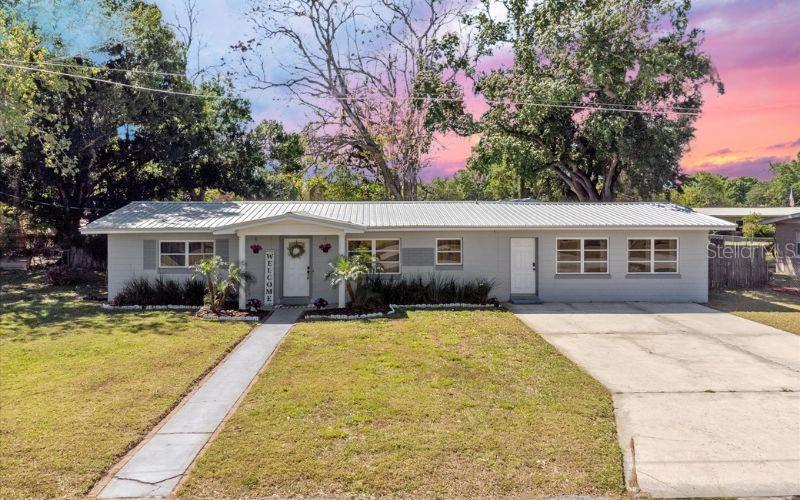 Looking for your new home on a large lot with no HOA? Schedule your showing today! Cooperative Seller is willing to contribute towards closing costs or a rate buy down to help buyers. Don't miss out on this move in ready, renovated home in Winter Haven. Perfectly situated in a treelined neighborhood close to several lakes with public access, this 4 bedroom 2 bathroom home invites you inside to experience it's spacious and open living. You immediately feel welcomed and ready to settle in. It's clear to see that this home has been loved and well maintained over the years. Recent updates include a new metal roof, interior paint and a completely updated kitchen with wood cabinets, stainless steel appliances and granite countertops. The kitchen is large and well designed, offering ample counter space for culinary creativity with a large additional pantry /storage area in the laundry room. The living areas offers 2 options for a living room or family room. A flex space could be a formal dining room, office area, play area, cocktail lounge area, the options are endless. The bedrooms are all well sized with large closets. Multiple doors lead out to a covered patio with a separate grilling area and into a fully fenced in yard complete with firepit and play area. There is still plenty of room to add a pool or even a large garden along with space to park a RV. Sitting on a lot generously sized at just under a quarter acre, with an extended driveway this home offers relaxed living with the ability to enjoy the outdoors and also store your toys. Perfect for entertaining and for pets to enjoy. Huge bonus is the oversized workshop/garage/potential ADU that allready has electricity. Located in a prime location this home offers easy access to major highways, schools, shopping, medical facilities, and dining options, plus Legoland! You're also an easy commute to Davenport, Lakeland, Tampa, Brandon and even St. Petersburg. The surrounding area is known for its outstanding natural beauty with a large offering of outdoor activities, walking trails, picnic areas, and scenic water views, making it a great place to relax and enjoy Florida living to it's finest. Call today to schedule a showing! ONE OR MORE PHOTOS ARE VIRTUALLY STAGED.