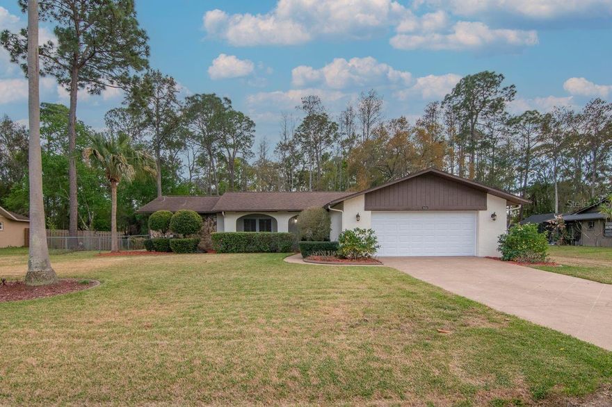 Welcome to this beautifully updated 3-bedroom, 2 bath pool home on a rare half acre lot with woods behind the property for added privacy and NO HOA. Located in New Port Richey this property offers the space and flexibility that is hard to find in the area. With plenty of room to store a boat, RV, or add a detached garage/workshop. Some of the homes recent updates include newer roof(2017), new HVAC(2020), water heater (2023), garage door and opener (2022), new water softener, and upgraded windows with hurricane shutters (2020). The kitchen features granite countertops, a spacious island for entertaining, and plenty of countertop space. The bedrooms are spacious and two of them have access to the beautiful screened in lanai. Enjoy the screened in pool year round with the solar heated pool. It features a new pool pump (2021), and pool cage that was painted and rescreened in 2023. This home is minutes from shopping, restaraunts, some of Florida's best beaches, and plenty more. Don't miss this great opportunity to own an updated home with a pool, land, privacy, and no HOA restrictions in this centrally located neighborhood!