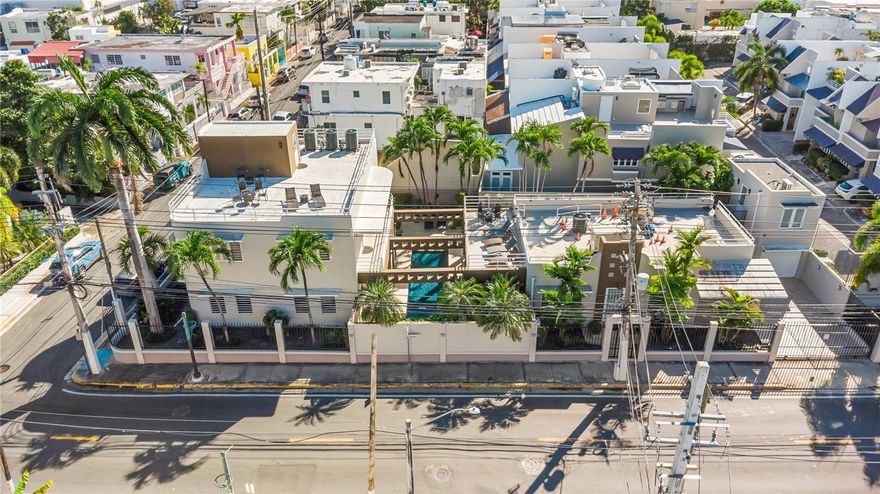 Rare opportunity to own a versatile multi-residence property just one block from Ocean Park Beach, located on a 715 m² (7,696 sq ft) corner lot in one of San Juan’s most desirable neighborhoods. This property offers flexible use as a primary residence, multi-generational home, or income-producing short-term rental, with multiple living areas that can be offered under one listing or separate listings.
The property currently consists of three separate residential units totaling 5 bedrooms and 6 bathrooms, plus an additional office/gym area, a pool connecting the residences, two enclosed garages and extensive outdoor and rooftop living spaces.
Current Layout- One-level Villa featuring 2 bedrooms, 2 bathrooms, kitchen,foyer, living-dining area, laundry room, and terrace overlooking the swimming pool. Second Villa - First-Floor Unit: Office/Gym with access to the pool. Second-Floor Unit: 2 bedrooms, 2 bathrooms, kitchen, living-dining area, laundry room, balcony, and stair access to rooftop terrace. Studio Apartment: Private studio with full bathroom, kitchenette, air conditioning, and access to a large furnished rooftop terrace. 
Additional Features: Two 1-car garages plus additional parking for up to 4 vehicles for a total of 6 parking spaces, swimming pool with dedicated pool bathroom, over 1,500 sq ft of open rooftop terraces, 50 kVA full-property generator, two 600-gallon stainless steel water tanks with pump systems, solar and electric water heaters, 3 central air conditioning systems plus 1 mini-split air conditioning system.
Expansion & Income Potential: The existing home office/gym area and additional garage spaces has potential for conversion into additional living units, tourism tax incentives, subject to zoning, permits, and buyer verification. This flexibility creates an opportunity to increase rental capacity and maximize short-term rental income in a high-demand location. Ideal for investors or buyers seeking a primary residence with home office and income potential in a premier coastal neighborhood.