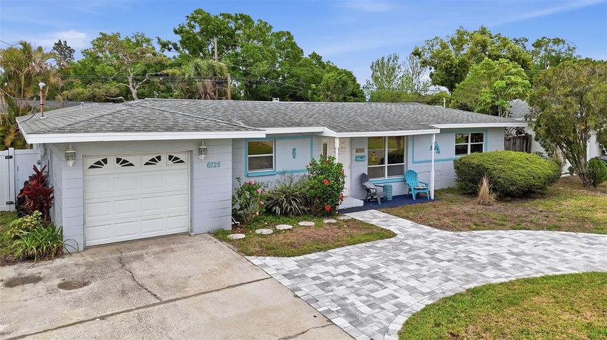 Rare opportunity to own a courtyard style pool home with a private guest suite in St. Petersburg. This 3-bedroom, 2-bathroom residence offers a unique layout centered around a sparkling in ground pool, creating a seamless indoor outdoor living experience. The home features an open and functional floor plan with abundant natural light, wood look flooring throughout the main living areas, and spacious living and dining spaces. The kitchen includes solid wood cabinetry, stainless steel appliances, ample counter space, and additional storage ideal for everyday living and entertaining. A standout feature is the attached guest suite with its own private bathroom, offering flexibility for multigenerational living, guests, a home office, or potential income producing use. Outdoor living is a highlight with a private courtyard pool, large screened in lanai, multiple seating and entertaining areas, and a fully fenced backyard with tropical landscaping. The layout provides a rare sense of privacy and resort style living. Additional features include attached garage, oversized curved driveway with ample parking, and move in ready condition. Conveniently located near shopping, dining, parks, downtown St. Petersburg, and just a short drive to Gulf beaches.