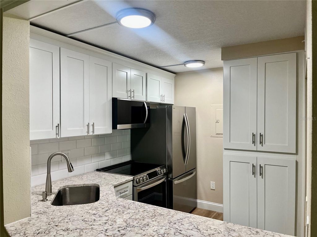 Photo of 1423 Pine Glen Lane #H2, Tarpon Springs, FL 34688 (MLS # W7884515)