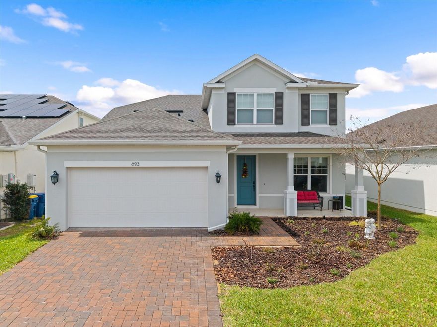 Experience the perfect blend of space, style, and location in this beautifully designed 5-bedroom, 3.5-bath home offering 3,211 sq. ft. of living space with a large driveway and 2-car garage in the highly desirable Park View at the Hills community in Minneola. Situated on a premium conservation lot with no rear neighbors, the home offers privacy and serene natural views. Inside, a separate dining area on the first floor welcomes you and flows into an upgraded kitchen featuring modern cabinetry, stainless steel appliances, ample counter space, and a walk-in pantry, perfect for everyday living and entertaining. The open-concept living room includes elegant motorized blinds for added comfort and convenience. The first-floor primary suite provides a private retreat with a large walk-in closet, dual vanities, and a spa-style walk-in shower. A laundry room and powder bath complete the main level. Upstairs features a spacious loft ideal for a media room, game room, or secondary living space, along with four additional bedrooms—all five bedrooms include walk-in closets. Two full bathrooms serve the upper level, including a Jack & Jill bathroom connecting two bedrooms and a shared bathroom with dual sinks and a tub for the remaining rooms. Step outside to an expansive L-shaped patio, perfect for relaxing or entertaining while enjoying the peaceful conservation views. Rain gutters are installed, and residents also benefit from a community storage building conveniently located behind Publix. The location is unbeatable; just 1 minute to Advent Health Minneola, 1 minute to the Florida Turnpike, and walking distance to Publix, restaurants, and shopping. Residents of Park View at the Hills enjoy a community pool, playground, and green spaces, with easy access to the lakes, parks, trails, and recreation throughout Minneola, Clermont, and Lake County, making this home the perfect combination of comfort, upgrades, and lifestyle.