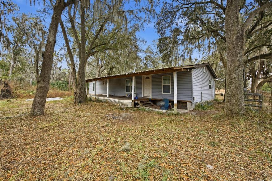 3.62 acres in a peaceful agricultural setting, offering the perfect opportunity for those seeking space, privacy, and room for farm animals. The property includes a 1970 mobile home, metal roof, with 3 bedrooms and 1 bathroom, best suited as an investor special or interim housing while planning future improvements.

The land is high and dry, located in Flood Zone X, providing added peace of mind. The property also features two wells, two septic systems, and two electric meters, offering flexibility for agricultural use, future development, or multi-use potential.

Surrounded by quiet rural scenery, this acreage is ideal for farming, livestock, gardening, or a private homestead, with plenty of room to build, expand, or customize. Enjoy the freedom of country living with convenient access to nearby amenities.
