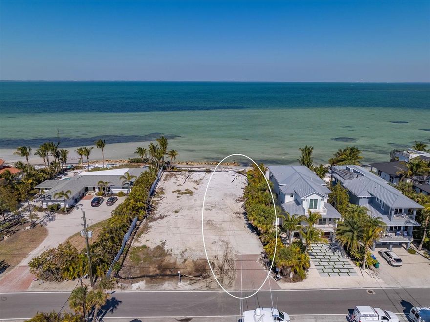 BAYFRONT LOT!   Private bay beach with 50 feet of frontage to build your dream home!!!!  The lot is 220 feet deep, there are endless possibilities!  There are very few lots with this much bay frontage and depth that are secluded.  Literally step out into your own sandy bay beach and enjoy views of the water and the Sunshine Skyway that also lights up your nightly view. Have a rooftop deck for a panoramic water view.  Restaurants within walking distance including the very popular Ocean Star for sushi and the Waterfront Restaurant.  Start living your island lifestyle in paradise today!