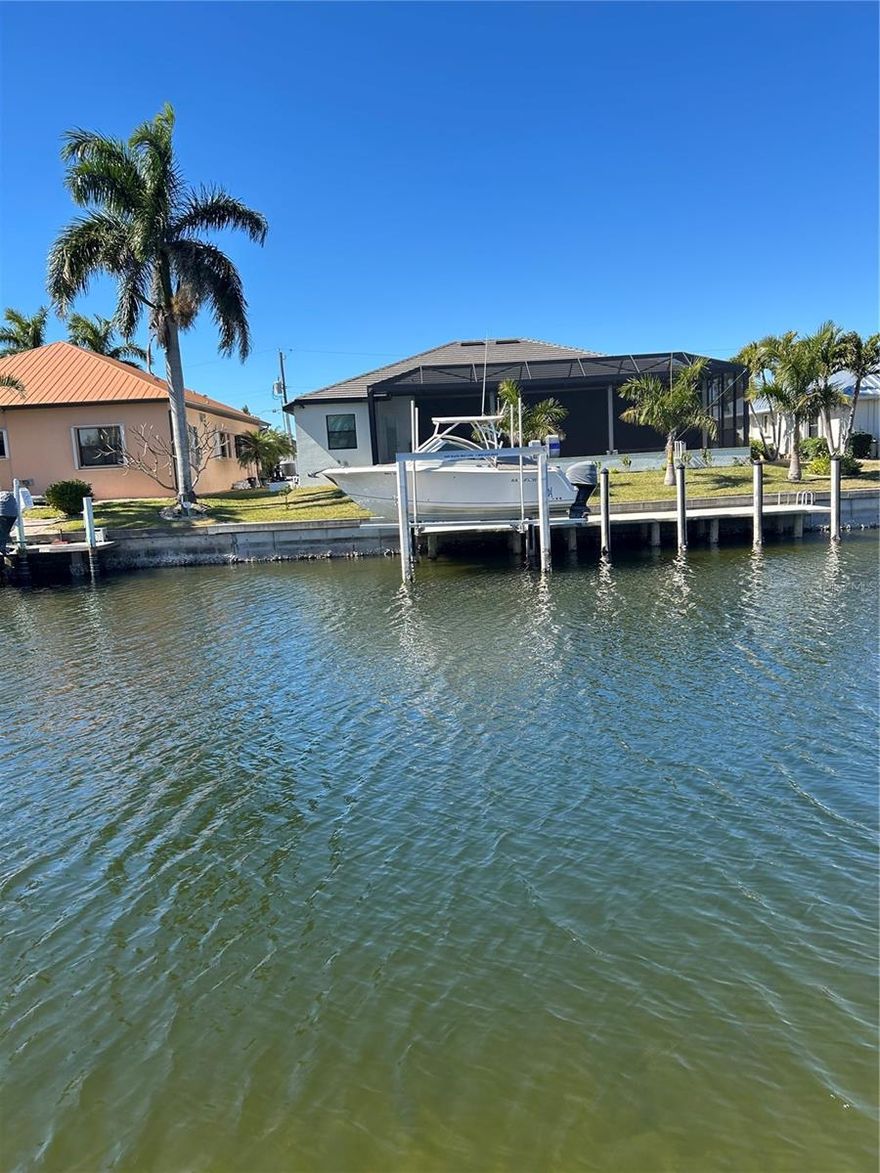 Calling all Boaters! Experience the ultimate Florida lifestyle on this stunning waterfront homesite in Punta Gorda Isles with fast sailboat or powerboat access! Boasting 80' of water frontage, this lot provides ample space for a large dock and a custom luxury pool home. Located on a wide, deep-water canal, you are just a short boat ride away from the open waters of the Gulf. This community offers a unique blend of elegance and leisure, with miles of walking paths, proximity to downtown Punta Gorda’s historic district, and sunset views that never get old. All city utilities are available at the site. City-maintained seawall included!