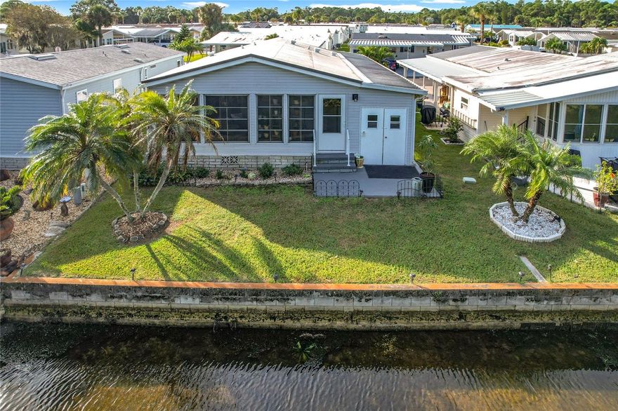 Turnkey Coastal Canal-View Home with Golf Cart in Lily Lake Golf & RV Resort

Step into this charming, light-filled mobile home nestled in the heart of the vibrant Lily Lake Golf & RV Resort community. From the moment you arrive, you’re greeted by lush landscaping and vibrant orchids that frame the entryway with tropical flair.

Inside, the home opens to a spacious, breezy layout featuring:

• A stylishly appointed kitchen with dual-sided access and coastal-inspired finishes
• A sunny dining nook and open-concept living room adorned with beachy artwork, elegant lamps, and soothing tones that evoke the serenity of a seaside retreat


 Just beyond the living room, step into the enclosed sun porch with panoramic windows overlooking a tranquil canal—perfect for birdwatching, fishing, or simply relaxing. A cozy outdoor seating area completes the peaceful vibe.

Down the hall, you’ll find:

• A laundry area with washer, dryer, and ample storage for cleaning supplies
• A beautifully decorated guest bathroom in soft coastal hues
• A serene primary bedroom with an en suite bath featuring updated countertops, light turquoise and accents, vinyl plank flooring, and generous closet space
• A welcoming guest bedroom with beach-themed furniture and décor


Bonus features:

• Turnkey and move-in ready—fully furnished with tasteful coastal décor
• Golf cart included for easy community access
• Generator wired to the main breaker—a must-have for Florida storm season
• Outdoor storage shed for tools and gear
