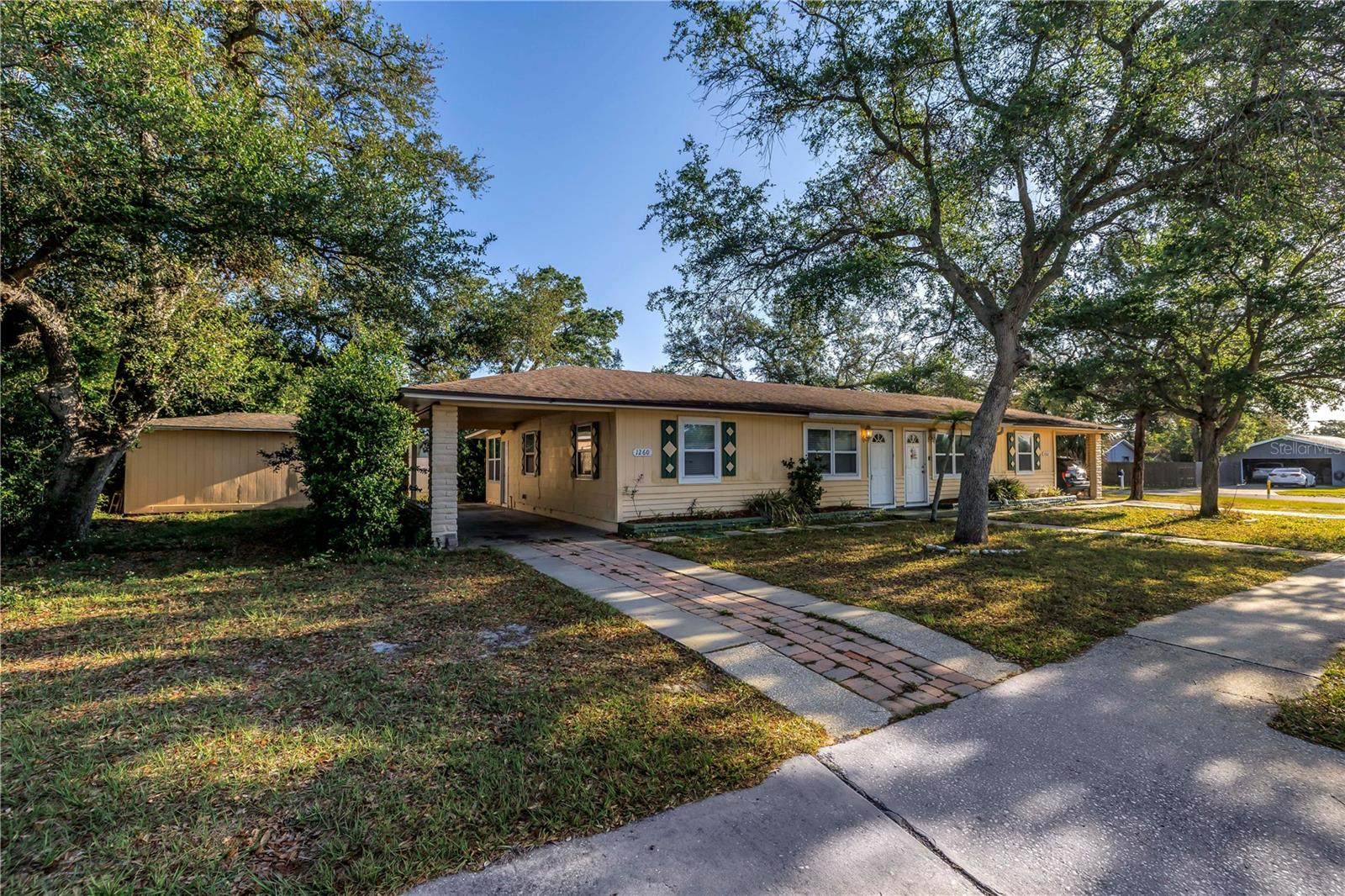 FULL ROOF REPLACEMENT 7/25.Turnkey duplex opportunity in the heart of Clearwater! Located directly across from the Clearwater Country Club and golf course, 1260 Palmetto St features two 3-bedroom, 1-bath units, each renting at $1,650/month with tenants covering their own utilities. (Value of washer/dryer hookups was not added to rent at time of leasing, providing an opportunity for potential rent increases after lease renewals). Separate electric meters, BOTH units recently renovated, new appliances in both units, washer/dryer hookups, and private backyard patios enhance tenant appeal. A storage shed offers added utility. Both AC units are older but functional, and the roof was recently updated in 2023 (buyer to verify). Just 13 minutes to the powdery sands of Clearwater Beach — a world-famous destination offering top-rated hotels, shops, restaurants, and vibrant entertainment. Downtown Clearwater’s cultural attractions and major medical centers are also close by. With immediate income and potential for future value-add, this property is perfect for investors seeking strong returns in a high-demand area. Recent appraisal done- $530,000. PLEASE DO NOT BOTHER TENANTS for anything. Lease for 1260 is through 4/26 and 1262 is 12/25. FULL ROOF REPLACEMENT 7/25