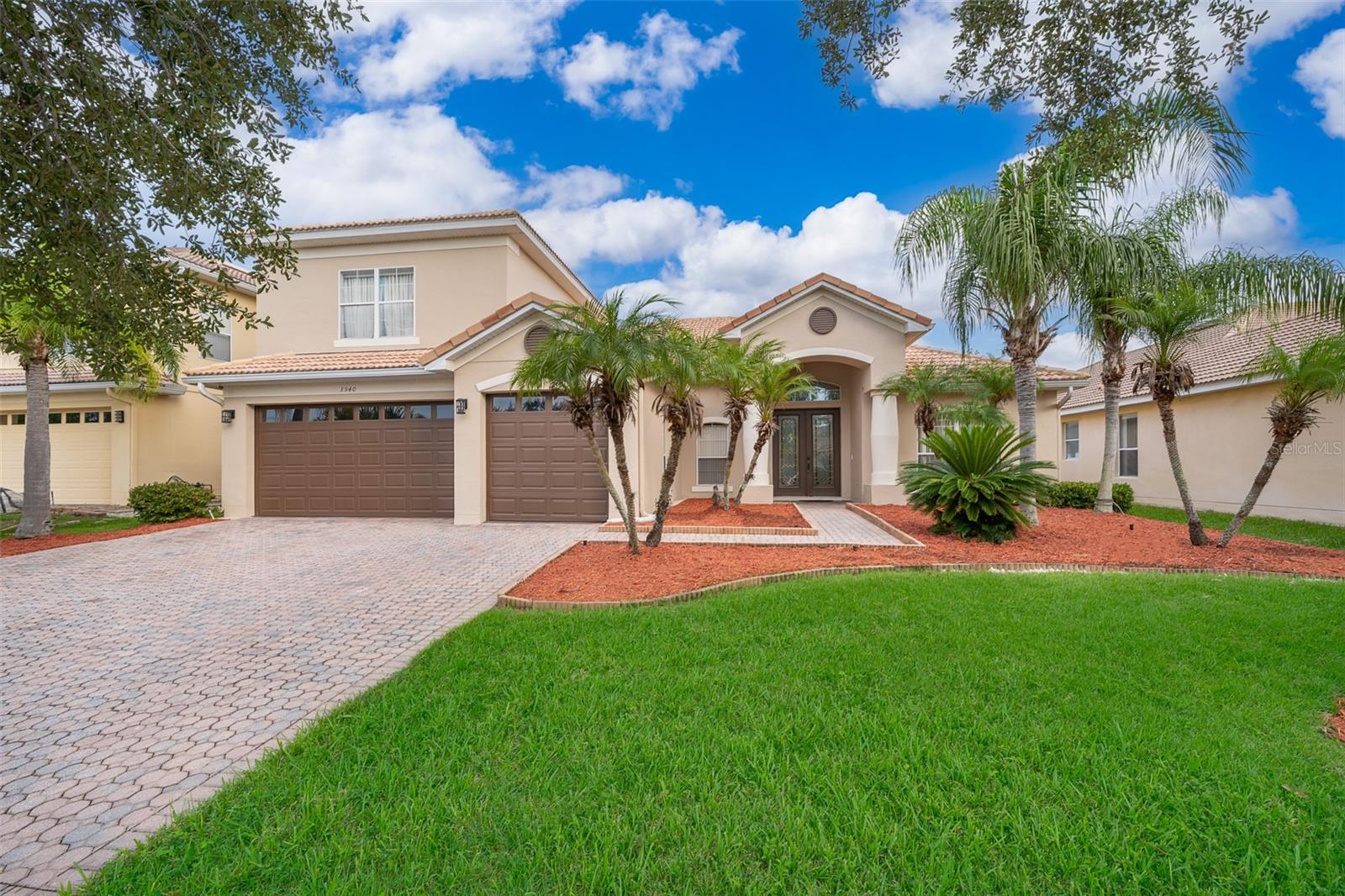 From the moment you arrive, the manicured landscaping sets the stage for the elegance that awaits inside. This stunning home offers over 3,000 heated square feet of thoughtfully designed living space. Step inside and you’ll be greeted by the seamless flow of all-tile flooring, freshly painted interior, and sophisticated designer light fixtures that bathe each room in a warm, inviting glow. At the heart of the home, a chef-inspired kitchen invites culinary creativity. White cabinetry, black granite countertops, and a custom backsplash perfectly complement the stainless steel appliances. An advanced water filter and softener—pure enough to drink straight from the faucet—adds a touch of everyday luxury. The main-level master suite serves as a private retreat, framed by custom drapes and filled with natural light. Its spa-like bathroom features a garden tub, a separate spacious shower, and an ambiance designed for pure relaxation. Two additional bedrooms share a stylish Jack-and-Jill bathroom, offering comfort and convenience for family or guests. Upstairs, a generous flex room with laminate flooring and its own full bathroom offers limitless potential—an extra bedroom, playroom, media room, home office, or guest suite—the choice is yours. Sliding glass doors open to a spacious screened-in patio overlooking a lush preserve—the perfect backdrop for morning coffee, evening cocktails, or simply soaking in the tranquil sounds of nature. Even the tiled garage reflects the home’s attention to detail, offering a clean, low-maintenance finish. Life in Bellalago means access to resort-caliber amenities: two multi-million-dollar clubhouses, multiple pools with slides and splash pads, tennis and basketball courts, a 1,300-foot boardwalk over Lake Toho with fishing piers and boat docks, fitness centers, walking trails, an on-site restaurant, and a vibrant calendar full of community events. Clean, updated, and move-in ready—3540 Valleyview Drive is more than just a home; it’s the beginning of your next chapter in comfort, luxury, and community. Conveniently located near shopping, dining, schools, and major attractions—yet peacefully tucked behind 24/7 manned gates—Bellalago offers a lifestyle that’s truly second to none.