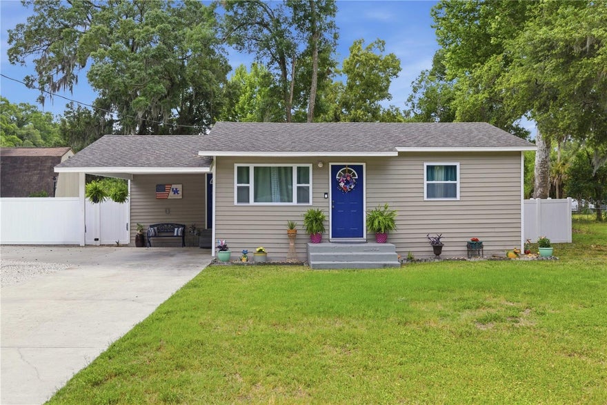 Not interested in new construction, but want the peace of mind of like-new systems? Welcome to 1512 NE 37th St, where nearly every major component of the home has already been updated for you. Major improvements completed in 2021 include the roof, HVAC, water heater, vinyl siding, septic tank and drain field, windows with marble sills, interior and exterior doors, plumbing, and electrical updates. The well was also replaced in 2020.

Inside, the kitchen and bathroom have been fully remodeled, and gorgeous cherry hardwood floors run throughout both the main home and finished outbuilding. Thoughtfully designed to maximize every inch, this home feels cozy, functional, and surprisingly spacious. The versatile flex space is large enough to accommodate a king-sized bed for guests, office space, or hobbies.

The kitchen offers comfortable prep and cooking space, and the movable island conveys for added flexibility. Washer and dryer also convey, making this truly move-in ready.

Step outside to enjoy the expansive yard complete with a spa, covered patio, extended driveway, and covered grilling area (grill does not convey). Electrical outlets were also added to the patio for convenience and entertaining.