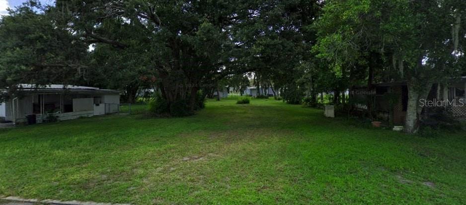 Discover your ideal Central Florida lifestyle! This beautiful, flat, and easily buildable lot is perfectly situated in a highly desirable 55+ golf community. Imagine designing your dream manufactured home on a lot that's ready to go. The Deed Restricted Community offers incredible amenities including a golf course, heated swimming pool, and a vibrant clubhouse with endless activities. You'll never be bored! Enjoy the convenience of being centrally located on SR50, with easy access to numerous hospitals, restaurants, and shopping, plus a quick commute to both Tampa and Orlando. Don't miss this opportunity – call today!