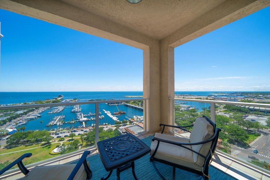 The views are jaw dropping with rows of floor to ceiling semicircular windows bending and arching towards overlapping Tampa Bay, Straub Park, Albert Whitted Airport, Marina, & Yacht Basin vistas from this 19th level DIRECT BEACH DRIVE 2 story Penthouse Home in the St. Petersburg sky, where no less than 4 terraces capture an eagle’s sense and sensibility. The interior impressions? Striking, awe-inspired, and thought provoking designed by the tastemaker who took two years of his life, and about $1.5 million dollars to reinvent, rebuild, and renovate the joint. A sublime 5,000 square foot blueprint is catapulted to another level, where MODERN is more, and the use of glass, ambient lighting, custom profusion doors, sweeping ART LEADED GLASS staircases take center stage, and why wouldn’t they? The aforementioned staircase alone was $250k. To further this forever timeless house and condo home a newly installed, curated and finished custom all wood HERRINGBONE FLOOR($200k) punctuates the stunning blend that is modern, yet transitional throughout. Enviable by its very conception there are: 4 SELF- CONTAINED BEDROOMS, EACH WITH EN-SUITE, IF NOT MULTIPLE EN-SUITES, AND WALK-IN CLOSETS. BUT, let’s talk about the PRIMARY SUITE, imagine a LOUNGING ARENA W/MORNING KITCHEN, HIS AND HERS SPA BATHS, TWO WALK-IN CLOSETS- HERS ALSO ENCOMPASSES A DRESSING ROOM, AND A VOLUME BEDROOM THAT IMBUES THE ENTIRETY OF THE ST. PETERSBURG SKY AND COAST LINE. Bespoke built-ins, breathtaking bath tiles, textures and textiles($200k) line walls that have been redrawn, remapped, and removed to add sinuous curves to each and every Bath, which now enjoys suspended glass under lit vanities, miles of mosaic glass installations, art glass doors, IPad mirrors, and legendary fixtures, hardware, plumbing, lighting, cabinetry, and world worthy appliances($750k). The Florencia fortress is sited directly on The Valley that is Beach Drive, and is a fast paced elevator ride to where 23 culinary adventures await, and every cultural, recreational and educational St. Pete opportunity beckon your response, and afford you a life well lived. 4 DEEDED UNDER THE BUILDING PARKING SPACES CONVEY IN THE SALE OF #1900. 
Let’s explore our future within this bastion. One or more photo(s) has been virtually staged.