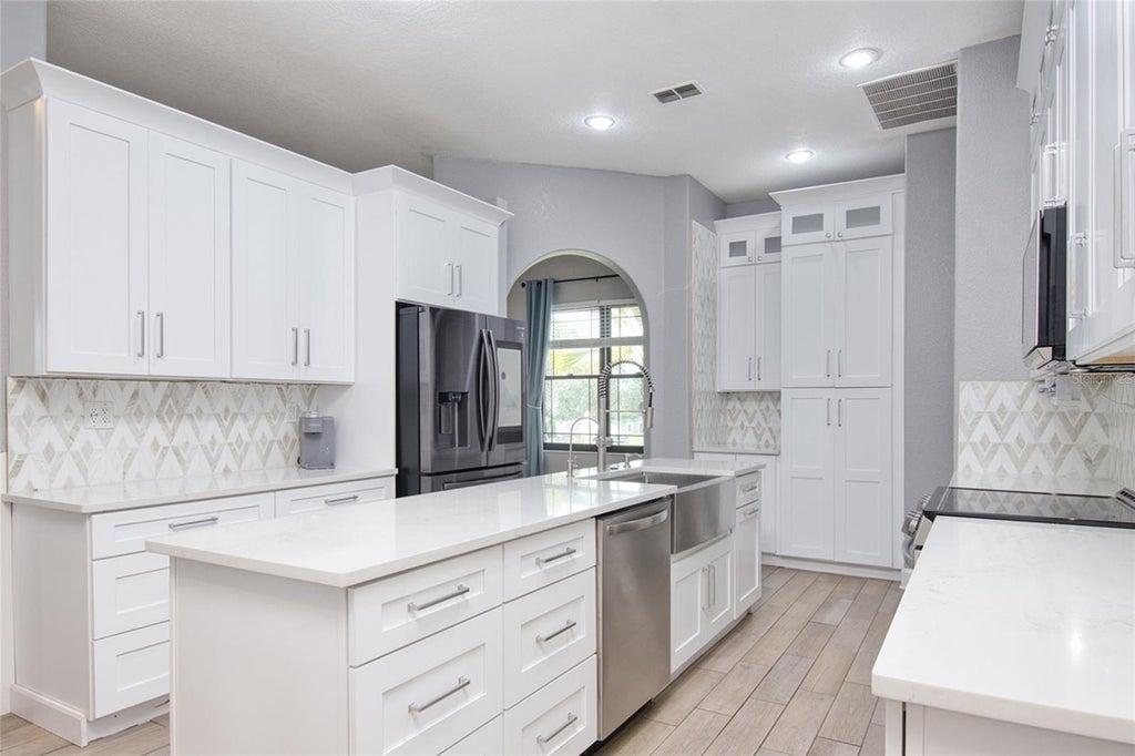 Photo of 10537 Versailles Boulevard, Clermont, FL 34711 (MLS # O6431254)