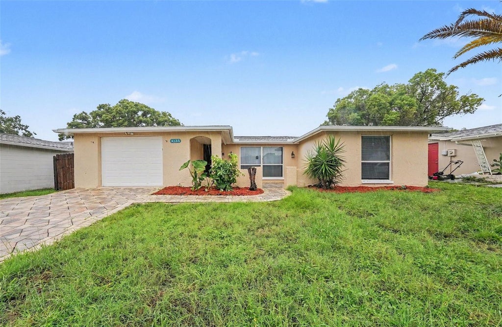 Photo of 9135 Hunt Club Lane, Port Richey, FL 34668 (MLS # O6430191)