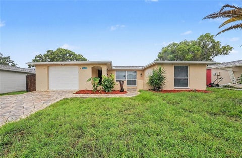Photo of 9135 Hunt Club Lane, Port Richey, FL 34668 (MLS # O6430191)