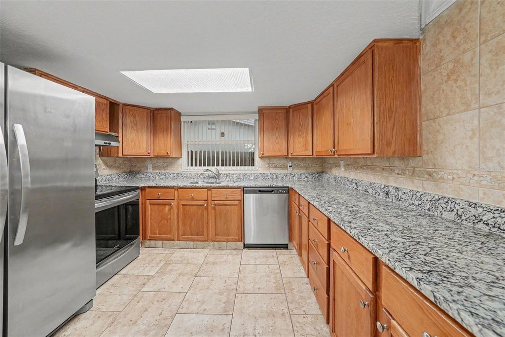 Photo of 9135 Hunt Club Lane, Port Richey, FL 34668 (MLS # O6430191)