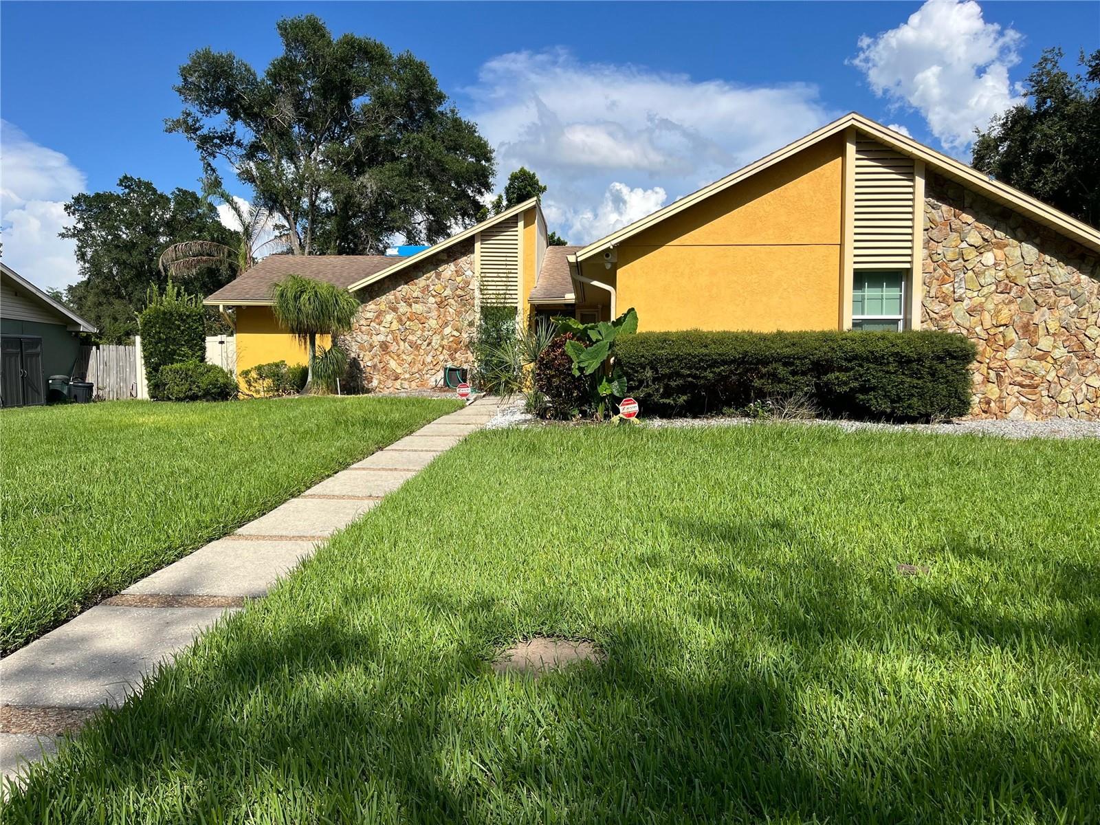 Spacious 3 Bedroom, 2 Bath Home
Welcome to this beautifully maintained home offering comfort, style, and convenience. Featuring updated roof, A/C, and drainfield, plus a freshly painted exterior, this property is move-in ready. Easy-care tile floors run throughout, and the open kitchen boasts an island prep area, closet pantry, breakfast bar, and ample cabinet and counter space.
The living room features a cozy wood-burning fireplace and sliding glass doors leading to an oversized screened lanai, perfect for relaxing or entertaining. All bedrooms are generously sized with great storage, and the primary suite includes a private office, walk-in closet, built-ins, and cathedral ceilings. The updated primary bath showcases raised wood cabinetry, granite countertops, and a stunning walk-in shower with skylight and rain shower faucet.
Enjoy the large corner lot with a privacy-fenced backyard, detached shed, mature shade trees, and beautiful landscaping. Located in a desirable SE Lakeland area, just off 540A, with quick access to the Polk Parkway, shopping, and Bartow