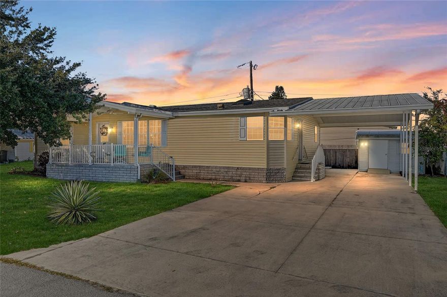Welcome to 917 50th Ave Ter W! Excellent opportunity to purchase this beautifully maintained, 3 bedroom / 2 bathroom / 1,560 sqft manufactured home! This stunning home sits on a generous double lot with land ownership, no HOA, and is easily mortgagable, offering first-time buyers a straightforward and attainable entry into the housing market. Homes of this size are rarely available in this community, making this property a truly standout find. Inside, soaring vaulted ceilings with sun-filled skylights create a bright, open atmosphere, complemented by rich hardwood flooring and a thoughtfully designed open-concept layout ideal for both everyday living and entertaining. The split floor plan offers added privacy, with the primary suite thoughtfully positioned on the opposite side of the home from the two guest bedrooms — perfect for owners seeking separation and comfort! The inviting kitchen features newer stainless steel appliances, ample cabinetry and storage, a spacious center island, expansive countertops, and a conveniently located laundry closet add to the kitchen’s thoughtful design and everyday ease. The home also features two separate entrances — one just off the carport for easy everyday access, and the other located just off your welcoming covered front porch! Outside, a large driveway and covered carport offer plenty of parking and convenience, while a storage shed provides extra space for tools, hobbies, or beach gear. Ideally located near popular restaurants, beautiful Gulf beaches, and Sarasota International Airport, this home blends space, privacy, and convenience — an exceptional opportunity in a community where homes of this caliber are rarely found!