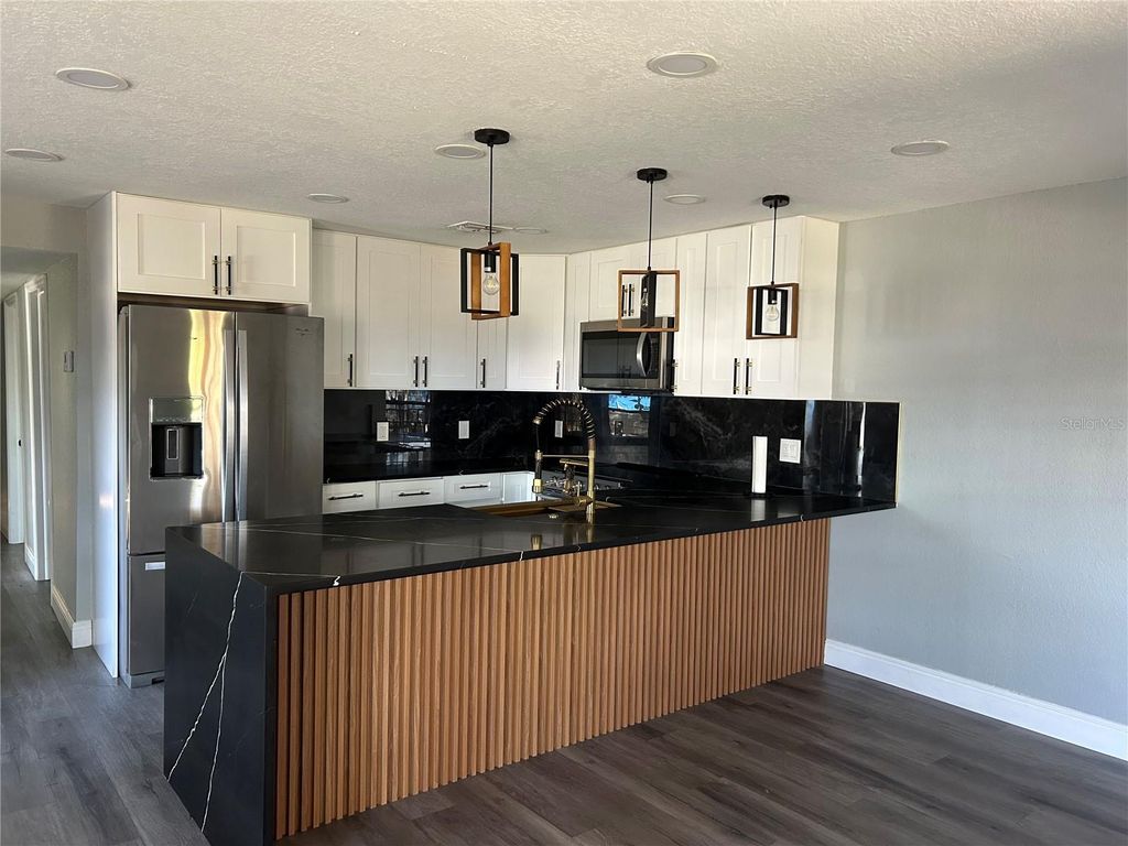 Photo of 2119 E Ellicott St, Tampa, FL 33610 (MLS # TB8473065)