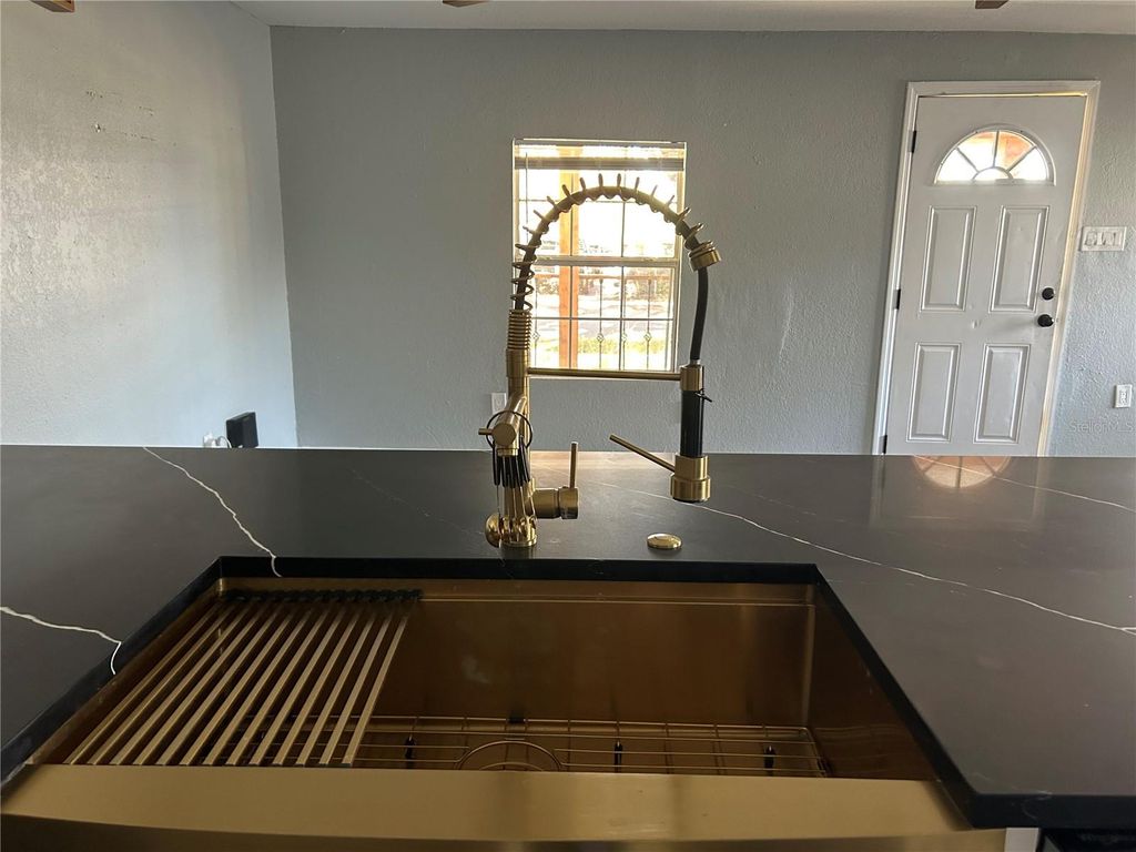 Photo of 2119 E Ellicott St, Tampa, FL 33610 (MLS # TB8473065)