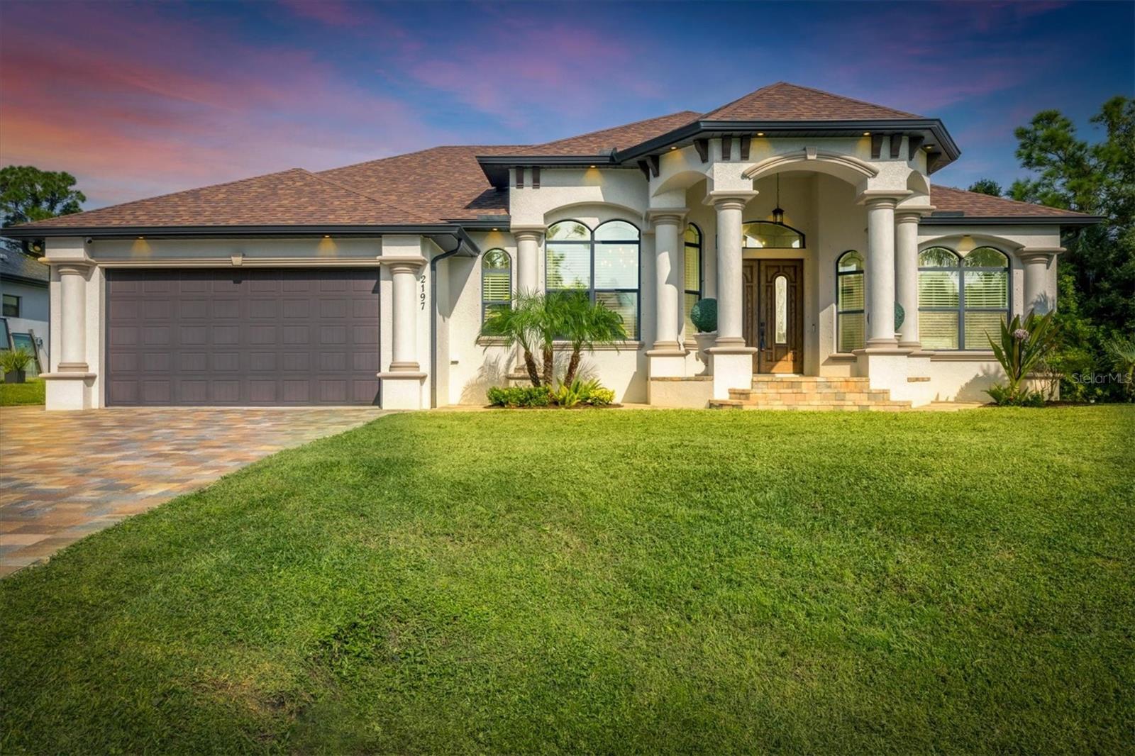 Experience ONE OF THE KIND true luxury in this stunning, beautifully built house in the heart of South West Florida. This house captures a modern, sleek feel with a Brand New Roof 2024 and a magnificent Waterfront view in your very own backyard. The water system is on reverse osmosis, and the owner has a monthly service plan in place to take care of the system. The house is beautifully molded as an open floor plan with high ceilings.This home is built high on stem wall for higher elevation; this home plan offers 2257 sq ft, and the screened patio is 785 sq ft. Home offers PGT windows and sliders, all doors are 8 feet tall, spray foam insulation, Tile flooring throughout the house, home security system installed, central vacuum system, family room has ceiling speakers connected from entertainment center, and whole home has reverse osmosis system for best quality water. This beautiful home has a very nice and modern built-in electric fireplace. Screened Patio has all the hookups for the outside kitchen, including a 220V electrical outlet. There is 1 inch of insulation in the walls throughout the house for better AC and heat efficiency. When you walk into the house, you'll love the high ceilings. The living room and dining room have 12'8 with a tray ceiling to 14', the family room has 10' with a tray ceiling to 11'4, and all bedrooms are 10' with a tray ceiling to 10'8. The kitchen has beautiful granite counter tops and luxurious cabinets.It is a one-of-a-kind house in a very peaceful neighborhood, minutes away from Warm Mineral Springs and the BRAND NEW WELLAND PARK, all major shopping centers the house is a short 15-minute drive from the beach. Situated in a vibrant and thriving community , this property promises a lifestyle filled with abundant sunshine, natural beauty, and coastal charm. NOT FLOOD ZONE! NO HOA OR CDD!GREAT ELEVATION! Nestled in the heart of North Port, this home benefits from its prime location, offering easy access to an array of amenities and attractions. Discover the nearby pristine Gulf beaches, where you can bask in the sun, partake in water activities, or simply relish the tranquility of the ocean. Embark on nautical adventures from the conveniently located marinas, allowing you to explore the region's captivating waterways and nearby islands. Fishing enthusiasts will delight in the world-class fishing opportunities, while golf enthusiasts can indulge in a variety of renowned golf courses. North Port is known for its thriving shopping and dining scene, featuring a diverse range of retail centers, boutiques, and restaurants. Immerse yourself in the vibrant downtown area, boasting charming shops, art galleries, and entertainment venues. The city hosts numerous cultural events, festivals, and community gatherings throughout the year, ensuring there's always something exciting happening. Beyond the city's amenities, this vacant lot offers proximity to breathtaking nature parks and preserves. Myakka River State Park is another nearby gem. North Port also boasts excellent educational institutions, reliable medical facilities, and convenient transportation options. The city's welcoming community and strong sense of belonging make it an ideal place to establish roots and create lasting memories. Experience the best of Florida living, with nearby beaches, golf courses, and outdoor recreational activities just a short drive away. Don't miss out on the chance to own this extraordinary home.