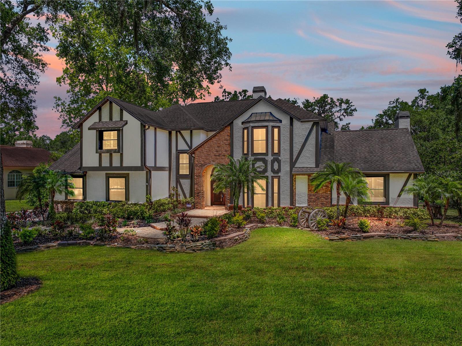 One or more photo(s) has been virtually staged. Stunning 4BR/3BA pool home on 2.08 acres located in the gated community of Waterford on the Alafia with private access to the Alafia River. Beautiful landscaping and fully pavered driveway greets you. This property will feel like your very own dream come true, fairy tale home. This property has so much to offer you with its acreage as well as river access to the gulf. Entering you will be greeted by the formal Living Room. Making your way around the main floor you will find the remodeled full bath. A newly remodeled laundry room with extra storage off the left hallway, allowing entry to the pool area. To the right of entry is the formal Dining room with a bay window and plantation shutters. If you love or are looking for a huge pantry this home has it! You will find the pantry has a mini sink, mini refrigerator, extra storage, shelving and plenty of room for those extra counter appliances. Moving further is the Family room with built-ins, a fireplace, and sliders to the pool. Opening into the Kitchen, you will find an eat-in area, huge island with mini sink, stainless steel appliances including a built-in double oven, a stainless country sink, quartz counters, wine fridge, and water dispenser above the stove. Up the stairs, you find wood flooring throughout the entire second level. The Primary bedroom boasts two walk-in closets, french doors to the balcony that overlooks the pool, and an En Suite featuring a dual sink vanity, jacuzzi tub, tile and glass shower, and a privacy stall commode. Bedroom 2 includes a walk-in closet and bay window with shutters. Bedrooms 3 & 4 also feature french doors to the balcony over the pool. The additional second level bath has been remodeled to include 2 vanities, tile and glass shower, and a claw-foot tub. The screened lanai includes pavers and heated pool not to mention hot tub. Out back is a paved fire pit and brand new wood boardwalk leading to the Alafia River. By the river, you will find an updated fishing "shack" that includes a mini-split a/c, loft, screened porch. Speaking of fishing if you love to fish there is a screened in fishing gazebo with an exterior porch making it all the more appealing. This gorgeous home has everything you need so schedule a showing today!