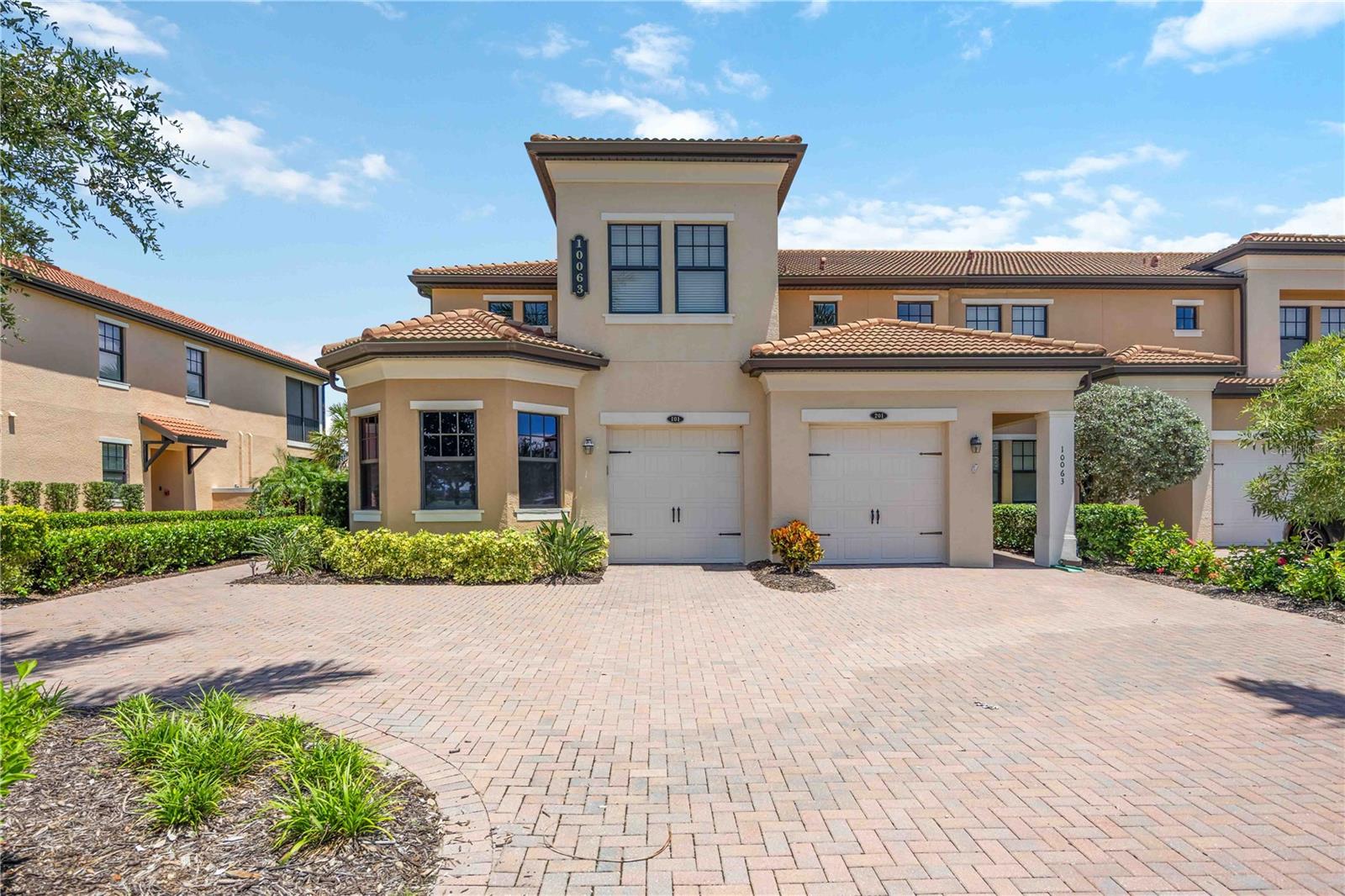 "Spacious 2-Bed, 2-Bath W/Den Condo Retreat in Beautiful Sarasota National!" Journey to your serene sanctuary at 10063 Crooked Creek Drive, Unit #101, in the charming city of Venice, FL. This spacious 1,571 sq ft condo offers an inviting retreat with two generously sized bedrooms, two full bathrooms plus an Office/Den, perfect for unwinding after a sun-soaked day at the nearby Gulf beaches. The open floor plan creates a seamless flow, ideal for both relaxing and entertaining in style. Imagine enjoying your morning coffee with the gentle Florida breeze on your private lanai, overlooking tropical surroundings. The well-equipped kitchen provides ample space for culinary adventures, with modern finishes that inspire creativity. Equipped with white shaker cabinets, quartz countertops and stainless steel appliances. Condo has 1 attached car garage with 1 extra parking space. Additional guest parking nearby. Located in the vibrant community of Sarasota National, you'll be minutes away from Venice’s acclaimed dining, shopping, and cultural attractions. Experience the convenience of nearby amenities while basking in the tranquility of your private oasis. Sarasota National amenities are transferable for $500. The condo is located in the non-golf section of Sarasota National. Golfing is still available during certain days and times. Whether you're seeking a seasonal escape or a year-round haven, this condo is the perfect blend of comfort and luxury. Embrace the Florida lifestyle in this beautiful, welcoming home that promises to be your personal paradise.