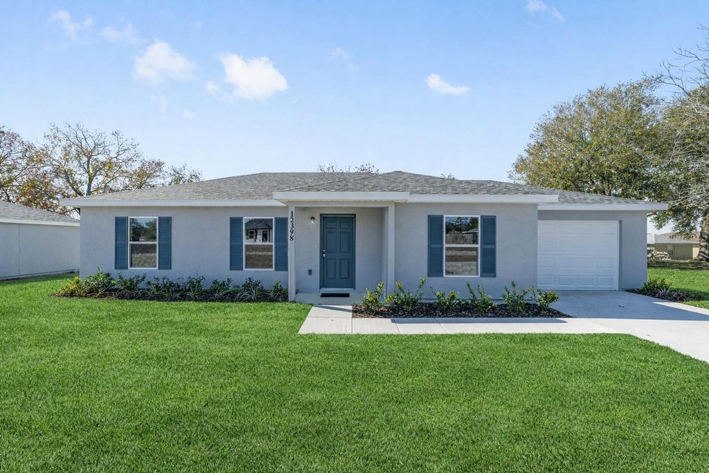 Photo of 12418 SE 102nd Terrace, Belleview, FL 34420 (MLS # OM718925)