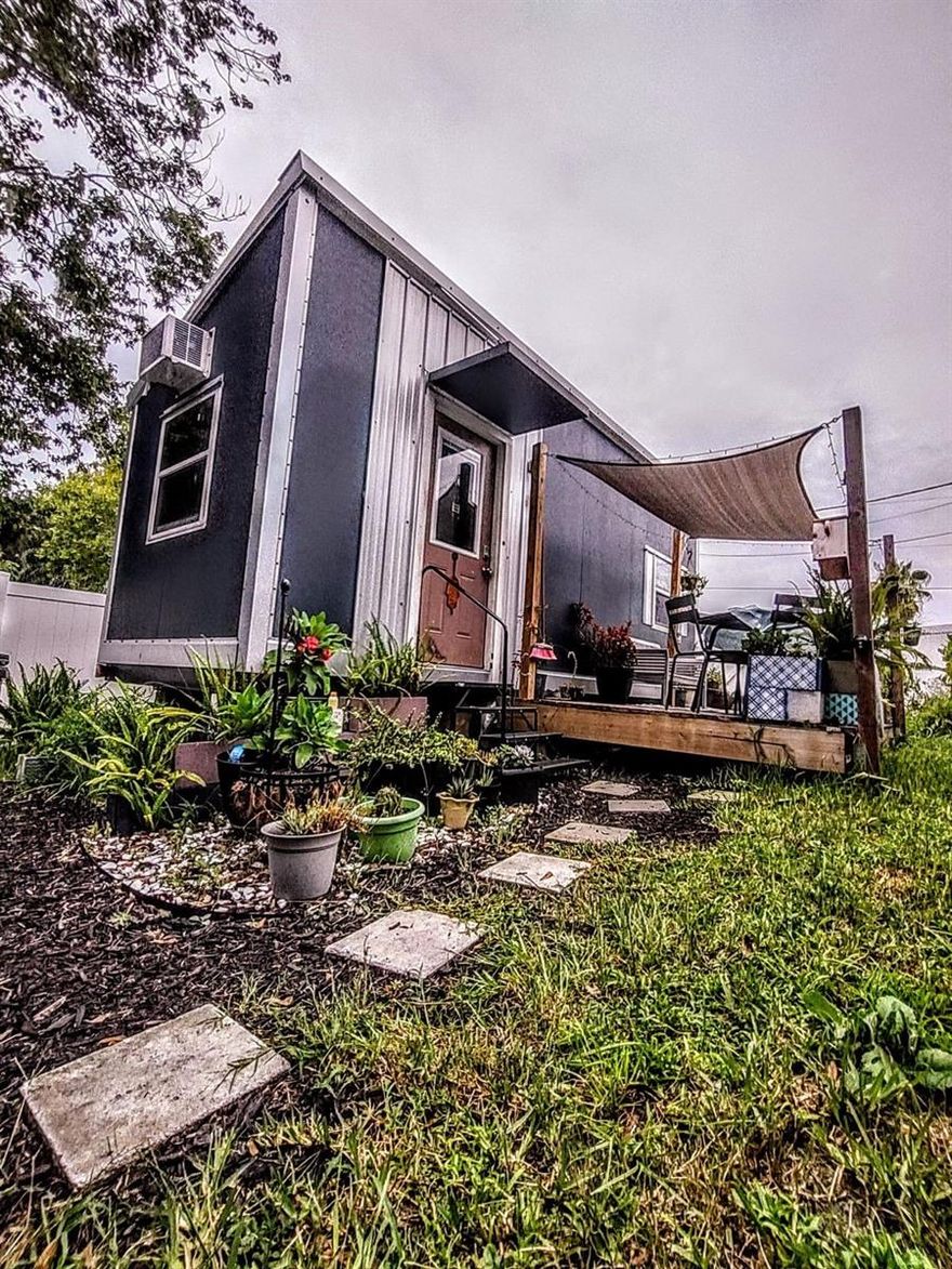 Charming detached tiny home available for rent on a quiet street in Kissimmee. This well-designed unit features a private entrance, kitchenette, full bathroom, and a fenced outdoor area with a storage shed. Suitable for up to two people, this home offers privacy, comfort, and easy maintenance. Rent does not include utilities—fixed monthly charges apply for electric, internet, and lawn care. No pets and no smoking. Renter’s insurance required. Conveniently located minutes from Poinciana Blvd, shopping, schools, and major highways. A clean and private living space in a peaceful setting.