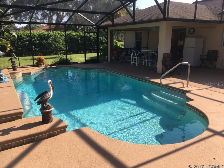 Beautiful and beautifully maintained xtra large corner lot pool home. If you need a place to park your boat or RV, this has that too!! with utility hookups.  Home features tile and laminate wood flooring throughout, vaulted ceilings, kitchen with stainless appliances, breakfast bar and pantry and a split floor plan.  French doors lead to the solar heated, salt water pool which features large screened lanai perfect to enjoy your outdoor space and pool furniture negotiable. Irrigation system on reclaim water to maintain the mature Florida Landscaping.  Breaker panel is wired to hook up generator. Extra large laundry room with wash tub and storage space. ;Water: City