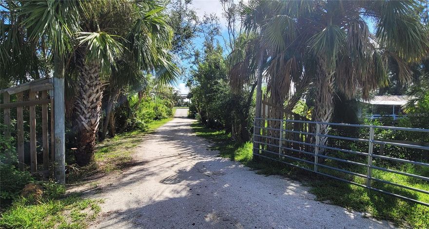 EXCLUSIVE 28-ACRE WATERFRONT OASIS: Imagine having your very own private peninsula, nestled amid the natural beauty of Southwest Florida. This remarkable opportunity presents itself with a sprawling 28-acre parcel, encircled by the serene waters of Shell Creek, boasting an impressive shoreline stretching upwards of 4,000 feet.  The property currently has two homes damaged by flooding. Electric will need to be evaluated along with the 2024 well....currently not functioning. For those who love life on the water, you'll appreciate the convenience of a boat launch. The two boat lifts not warranted unknown if functioning. Fishing enthusiasts will revel in the fun that awaits just beyond your doorstep. Whether you envision a waterfront estate, a cozy cottage, or a tranquil retreat, the possibilities are boundless. Property is gated. Accessible by appointment only.Although photos depict homes and out buildings on the property; they are hurricane damaged. This sale for  acreage only. Please review photos of this one of a kind property!