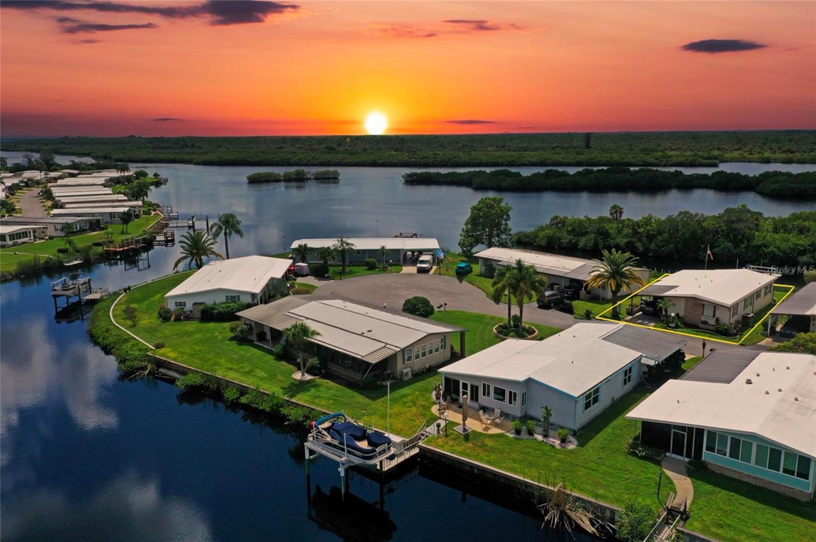Welcome to Lazy River Village and bring your fishing poles! Rim canal home with views of the Myakka River! One of the premiere (if not THE best) 55+ waterfront manufactured park in all of Sarasota and Charlotte counties! The BEST amenities, clubs, and selection of activities you will find in any co-op park in all of Sarasota county and even Charlotte County. Lazy River is located on the banks of the beautiful Myakka River. This quaint, inviting home boasts plenty of windows to enjoy the Florida sunlight and wildlife and warm-toned laminate flooring is easy to maintain while providing a luxurious look. The living room/dining room combo features a back wall of full windows; sliding doors which lead to a bright Florida Room, perfect for entertaining friends during evenings, Built-in storage/display cabinets in the dining room to store any other items. *Most all furnishings will remain for the convenience of the seller**
The kitchen includes all the conveniences needed to prepare your favorite meals, including solid surface countertops and plenty of cabinets to store all your favorite snacks, spices, and cookware. Both the master and additional bedrooms have direct access to the bathrooms, with a walk-in closet in the primary bedroom space, and dual sliding mirror closets in the other bedroom space. The master bathroom includes a wide counter with two sinks, plentiful overhead lighting, and door which sections off the toilet area for additional privacy. The second bathroom also includes plentiful overhead lighting and a long countertop; there are also 2 doors which connect to the secondary bedroom AND main living area.
An office area lends extra space for your favorite projects, hobbies, etc, with direct access to both bedrooms. Closets are plentiful through-out the home. Storage! Location, Location, Location!
This home is the prime seasonal place to enjoy Florida's coveted gorgeous winters and a perfect year-round home for those who love all 4 seasons of Florida. If you enjoy an abundance of activities, you have plenty to choose from in Lazy River Village: Pickleball, tennis, bike clubs, card clubs, pontoon boating--even a professional woodworking shop. A low monthly fee of $276 includes all the amenities. Other amenities for anextra fee, boat slip & storage.
One of the things that makes Lazy River Village so great is its proximity to...well...everything! Be prepared to enjoy Florida's wildlife at its finest, both inside the Lazy River Village complex and at abundant state parks and nature preserves. Shopping and dining surround you in all directions. The spring training homes of both the Atlanta Braves & the Tampa Bay Rays are just a minutes away. The world-renowned Gulf of Mexico beaches are all within 30 minutes or less! 1) Englewood beach, 2) Casperson Beach (GREAT for shelling), 3) Venice Beach (shark tooth capital of the world), 4) Brohard Paw Park, 5) Nokomis beach (you've GOT to experience the weekly drum circles), 6) the island gem of southwest Florida: Boca Grande... And finally: 7) Siesta Key in Sarasota has been ranked multiple times as the number one beach in the nation and is a mere 35 minutes away. Lazy River Village offers a lifestyle that every retiree dreams of. You have the quaint downtowns of Venice and Punta Gorda--both cities are often ranked as Top 10 destinations in the country for retirement. Another local favorite, Englewood, is a cozy, fun beach town on the Gulf of Mexico. *I-75 is minutes away.*