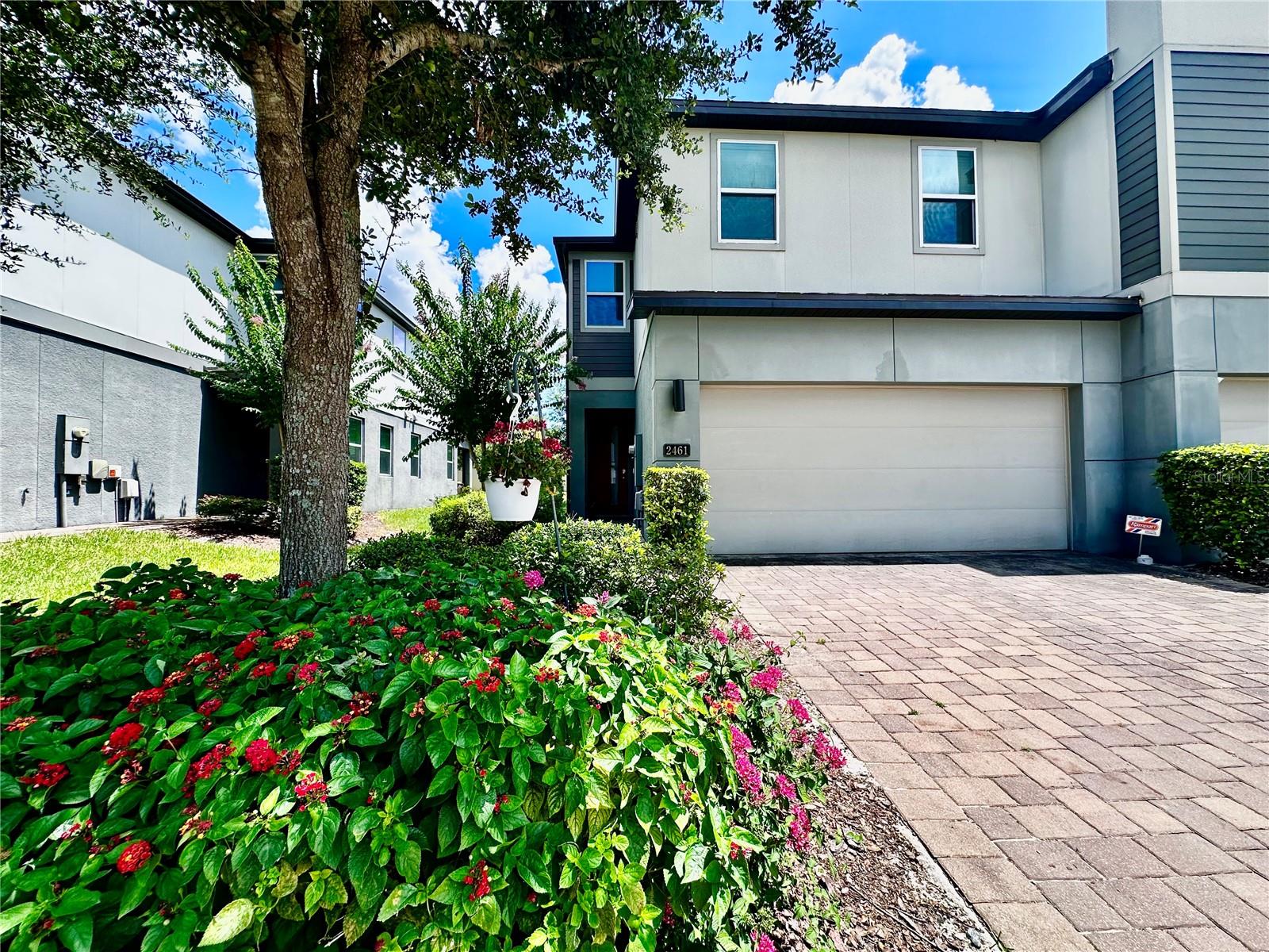 GREAT LOCATION!! Come and check out one of Winter Park's newest neighborhoods, Hawks Crest! This stunning townhome has brand new paint throughout and features 3 bedrooms, 2.5 bathrooms, an open concept living space perfect for entertaining, high ceilings, a screened in lanai upgrade, 2 car garage, large pantry, stainless steel appliances, spacious rooms, tons of storage, a HUGE master bedroom with tray ceilings, ensuite bathroom and walk in closet, and an upstairs laundry room. The kitchen strikes the ideal balance between style and functionality, featuring extra cabinet space and large island. This beautifully manicured community offers modern architecture, a tasteful color palette, brick pavers, a resort style pool, playground, picnic and BBQ areas, designated dog walks, trails, and exercise stations. This stunning GATED community is all about living the resort life! Experience this exclusive energy efficient newly built townhome community in the highly desirable Winter Park area, conveniently located near Winter Park Village, shopping, dining, major highways, airports, theme parks, UCF, Rollins College, Full Sail, and so much more! Don't let this rare opportunity to live in Central Florida's highly sought after Winter Park pass you by!!
