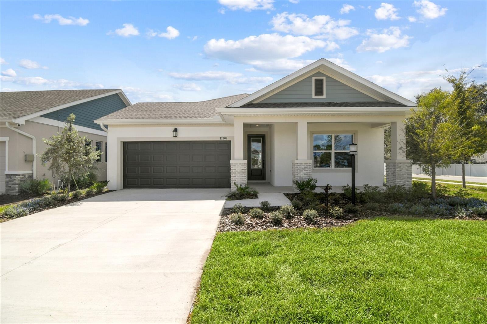 The Sparkman by David Weekley Homes is a 4-bedrooms, 3-bathrooms with an additional study on lake Rhodine and is move-in ready. The heart of the home is an expansive kitchen with high-end finishes, abundant cabinetry, and a large center island that overlooks the spacious family room. The study offers a quiet retreat for work or hobbies, while the secondary bedrooms provide ample space for family and guests. The luxurious owners retreat is complete with a spa-like en-suite bathroom and an oversized walk-in closet. A two-car garage offers convenience and storage. Opportunities to own a home with views of the lake on your patio are rare. Act fast before it's gone.