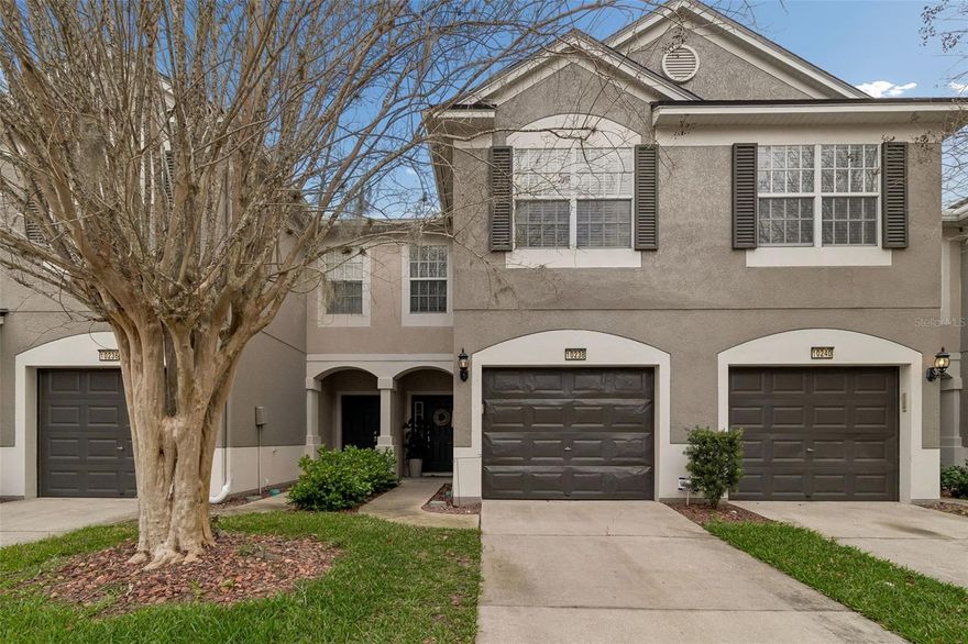 Comfort meets convenience in this beautifully maintained townhome located within the gated, pet-friendly community of Westpark Preserve. Featuring a sparkling resort-style pool, new roofs installed in 2025, water/sewer/trash included in your HOA fee, and so much more, this home offers the perfect blend of low-maintenance living and tranquil surroundings. Step inside to discover a warm and inviting interior with no carpet anywhere—only beautiful engineered hardwood and tile throughout. The open floor plan features a kitchen overlooking the dining area and living room with a powder bathroom. Out back beyond an 8ft tall 3-paneled sliding glass door is a screened-in patio creates the ideal spot to unwind with your morning coffee or evening glass of wine, overlooking a shared fenced in green space that adds to the home’s peaceful setting. Upstairs, all three spacious bedrooms are thoughtfully located near the laundry closet. The primary suite is a true retreat, complete with a vaulted ceiling, walk-in closet, and a private en suite bath, and overlooks a picturesque lake and conservation area, providing a sense of serenity and natural beauty right outside your window. Positioned just off the Veterans Expressway, this home makes commuting effortless while keeping you close to everything Tampa has to offer—only a 15-minute drive to Tampa International Airport and premier shopping and dining at International Plaza. Enjoy the best of both worlds: a quiet community setting with unbeatable accessibility.