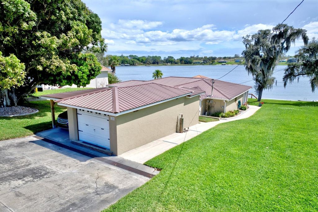 Photo of 125 Mccoy Drive, Lake Placid, FL 33852 (MLS # C7523925)