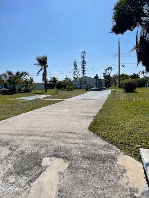 HUGE PRICE IMPROVEMENT! MOTIVATED SELLER! Cleared, buildable lot is available in the small 55+ waterfront community of Mobile Gardens. The home on this prime parcel was destroyed by Ian and the lot is ready for a new mobile home to be built or bring your manufactured home and set up. The adjacent lot 308 is available for sale as well. Build your dream home here an start living the good life in Englewood! This property offers easy access to Oyster Creek, Lemon Bay and the Gulf of Mexico -- an ideal choice for the water enthusiasts. Mobile Gardens is a close-knit community which has a clubhouse and very active and engaging residents where the Homeowners Association (HOA) membership is optional to join. Featuring a recreational facility, shuffleboard courts and lively social calendar you will find yourself emersed with many friends from which to enjoy your Florida lifestyle. Mobile Gardens is only a short golf cart drive to the community marina which has direct gulf access. You are within steps of the community boat ramp. First come-First served docks and boat slips with optional HOA. Mobile Gardens is located only minutes from Manasota Key and Englewood Beach, shopping, dining, and all the fabulous events that makes living in southwest Florida one of the BEST!! Water and electricity is available and connected and only sewer needs to be connected. Located in Engelwood just blocks from 776, short trips to Boca Grande, world-class fishing, numerous golf courses and TWO Major League Baseball Spring Training stadiums! Join the optional HOA at Mobile Gardens to have access to the clubhouse, activities, shuffleboard courts and more. This particular lot (along with 308) has additional features in that it is strategically located for quick, easy and convenient access to shopping, dining, not to mention the "take your breath" away sunsets at the Gulf Beaches. This is a fabulous opportunity for anyone seeking a "Florida Livng Experience in the Coast". Come design your dream home and starting the Florida Dream Now! WELCOME HOME!