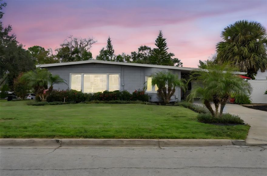 Prime Downtown Clermont location! This beautifully maintained 4-bedroom, 2-bath home with 1,567 sq. ft. offers vintage character paired with thoughtful modern upgrades. Perfectly situated on a corner lot with peekaboo views of Lake Minneola and NO HOA, you’ll love being just one block from Waterfront Park, the boat ramp, beach, and scenic walking and biking trails. Inside, an open and airy floor plan seamlessly connects the living room, dining area, and kitchen—ideal for everyday living and entertaining. Tile flooring flows throughout the main living areas, while classic terrazzo flooring adds charm to the bedrooms. The updated kitchen shines with quartz countertops and backsplash, soft-close cabinets with upgraded hardware, and stainless steel appliances, including a new refrigerator. The primary suite is a private retreat featuring an en suite bath with a walk-in shower. The second bath has been stylishly refreshed with a modern vanity and light fixture, updated toilet, and fresh paint. The fourth bedroom doubles as a true flex space, perfectly suited for a home office, library, art studio, fitness room, or dedicated hobby space with endless possibilities. Closets By Design systems enhance storage in two of the bedrooms, including the primary bedroom. The well-appointed laundry room features built-in shelving and a wooden table perfect for folding or organizing. Outdoors, enjoy a fully fenced backyard with a composite wood deck—perfect for relaxing or entertaining—surrounded by mature landscaping and irrigation in both the front and backyard for picturesque curb appeal. Lovingly cared for and ideally located near downtown shopping, dining, entertainment, and year-round events, this home offers charm, functionality, and an unbeatable lifestyle in the heart of Clermont. Schedule your private showing today! *Aerial photo property lines are an estimate and to be verified by buyer.