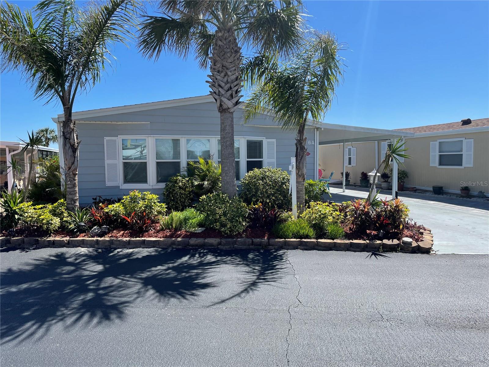 YOUR LITTLE PIECE OF PARADISE AWAITS YOU! Spacious! Wonderfully Maintained! The Kitchen and the Two Bathrooms were renovated as was the Front Bedroom to include the replacement of the windows! Also BIG PLUS the Porch was remodeled to add to this Cozy Comfortable Furnished Home with Gardens Galore!! Are YOU LOOKING for a FUN FUN FUN 55+ Community that OFFERS Spectacular Sunsets over the IntraCoastal as well as Access to the Atlantic Seaboard just a short distance to the East. This Community offers a HEATED POOL in the Winter and a COOLED POOL in the Summer! The Club House is TOP NOTCH! Take the Elevator to the TOP for a Moonlight Rendezvous or stop off at the Community Recreation Areas: Billiards, Dancing, Yoga, Weight Room. The Kitchen is Commercial Grade! The Two Fishing Piers are complete with electric and water for cleaning the days CATCH! NEGOTIABLE!
The designated Doggie areas are a great place to socialize and meet new friends. There is a Social Committee that creates a new Calendar each Month for extra Activities! Outdoor Grills/Gazeboes/Kayak Storage!
Many Upgrades! NEW AC-HVAC 2024 NEW WINDOWS 2020 and 2024 RE ROOF 2023 and EXTRA LARGE WALK-IN CLOSETS and PLENTY OF STORAGE!!! Motivated Seller Negotiable!