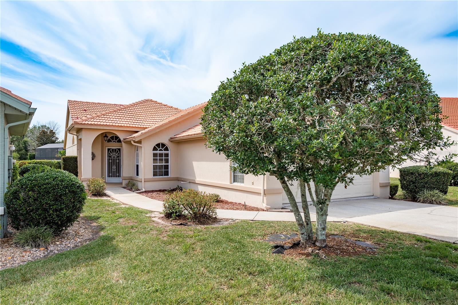 Welcome to this charming two-bedroom, two-bath home with a two-car garage, located in the highly sought-after Glen Lakes Golf Community—an ideal spot to enjoy the Florida lifestyle! As you enter, you’ll immediately notice the meticulous care and upkeep of this property. The spacious great room features an open-concept design that seamlessly connects the kitchen, dining, and living areas—perfect for both entertaining and relaxing at home. The kitchen is a chef's dream, with ample real wood cabinetry, expansive granite countertops, and a stainless steel farmhouse apron sink. All kitchen appliances, along with the washer and dryer in the convenient indoor laundry room, are included. You will love the ease cleaning with the added central vac system.
This home offers a well-designed split bedroom layout with vaulted ceilings, creating an airy and expansive feel. The master suite is generously sized, complete with a large walk-in closet featuring custom shelving. The ensuite bathroom features a spa-like tub and shower that you'll love relaxing in. Step outside to your private patio, a peaceful retreat where you can enjoy morning coffee, read a book, or unwind after a busy day. The natural landscaping and lack of backyard neighbors create a serene atmosphere.
Glen Lakes offers a wealth of amenities, including golf, a driving range, putting green, tennis, pickleball, an Olympic-size pool, and more. A full calendar of social events ensures there's always something to do. The HOA fees cover cable, high-speed internet, lawn care, sprinkler maintenance, road upkeep, and 24-hour manned security.
Glen Lakes is a gated, secure golf course community nestled within the 85,000-acre Chassahowitzka National Wildlife Refuge. While a social membership to the clubhouse, restaurant, and bar is optional, it grants you access to additional amenities. With something for everyone, this community truly has it all!