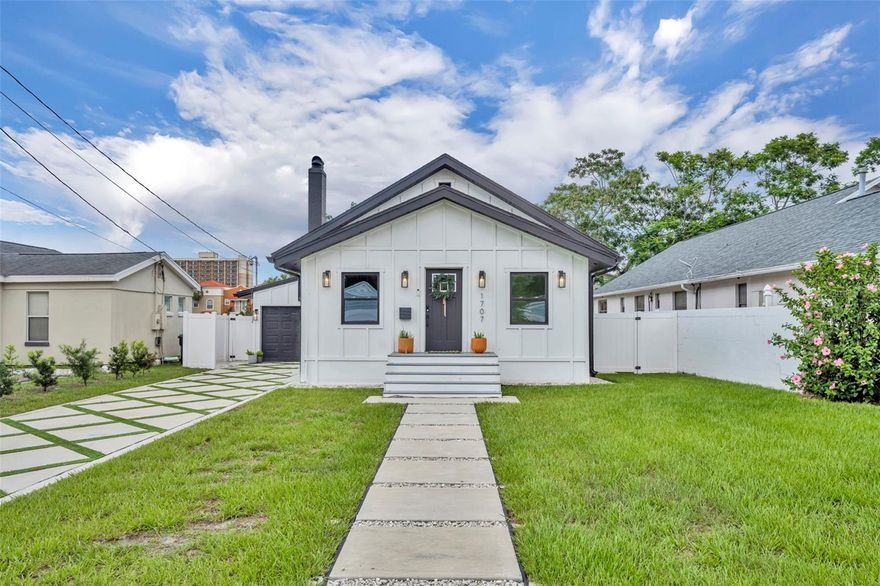 A timeless blend of historic charm and modern luxury awaits in this beautifully restored 1927 Florida bungalow, nestled in the highly sought-after and peaceful neighborhood of Orwin Manor in Winter Park. Rich in character and thoughtfully updated throughout, this exceptional residence seamlessly combines the elegance of its original architecture with the comfort and sophistication of modern living. Upon entering, you are welcomed by an inviting foyer featuring new tile flooring and refined vertical shiplap detailing, setting the tone for the home’s timeless design. Custom transitions lead into the spacious living room, where original hardwood floors, a cozy fireplace, and smart lighting create a warm and inviting atmosphere ideal for both entertaining and everyday living. The formal dining room comfortably accommodates gatherings of eight and is highlighted by a stunning Serena & Lily chandelier, creating the perfect setting for memorable dinners and celebrations. Just beyond, the fully renovated chef’s kitchen serves as the heart of the home. Updated in 2020, it features elegant Calacatta countertops, an oversized island, premium Samsung appliances, and stylish West Elm lighting. An adjacent eat-in dining space offers a more casual setting and opens directly to the beautifully paved backyard, perfect for outdoor dining and entertaining.
The home’s accommodations are equally impressive, including a serene primary suite complete with dual closets and a beautifully appointed bathroom featuring sleek matte finishes. Additional living spaces include a versatile recreation room and a well-appointed guest bedroom, each designed with both comfort and functionality in mind. A private attic provides valuable additional storage space. Every detail of the home has been carefully considered to enhance both aesthetics and practicality, including smart exterior lighting, a durable vinyl privacy fence, low-maintenance landscaping tailored to Florida living, and an updated Carrier HVAC system with a smart thermostat for year-round comfort. Preserving the integrity of the home’s historic character, original woodwork, including baseboards and casings, has been thoughtfully maintained, while curated paint selections and Trex exterior staircases add lasting beauty and durability. Ideally located just minutes from Park Avenue, College Park, and major thoroughfares, this remarkable property offers an exceptional combination of tranquility, convenience, and community. More than just a home, it is a rare opportunity to own a beautifully preserved piece of Winter Park history where timeless charm and contemporary elegance exist in perfect harmony. New roof 2026***