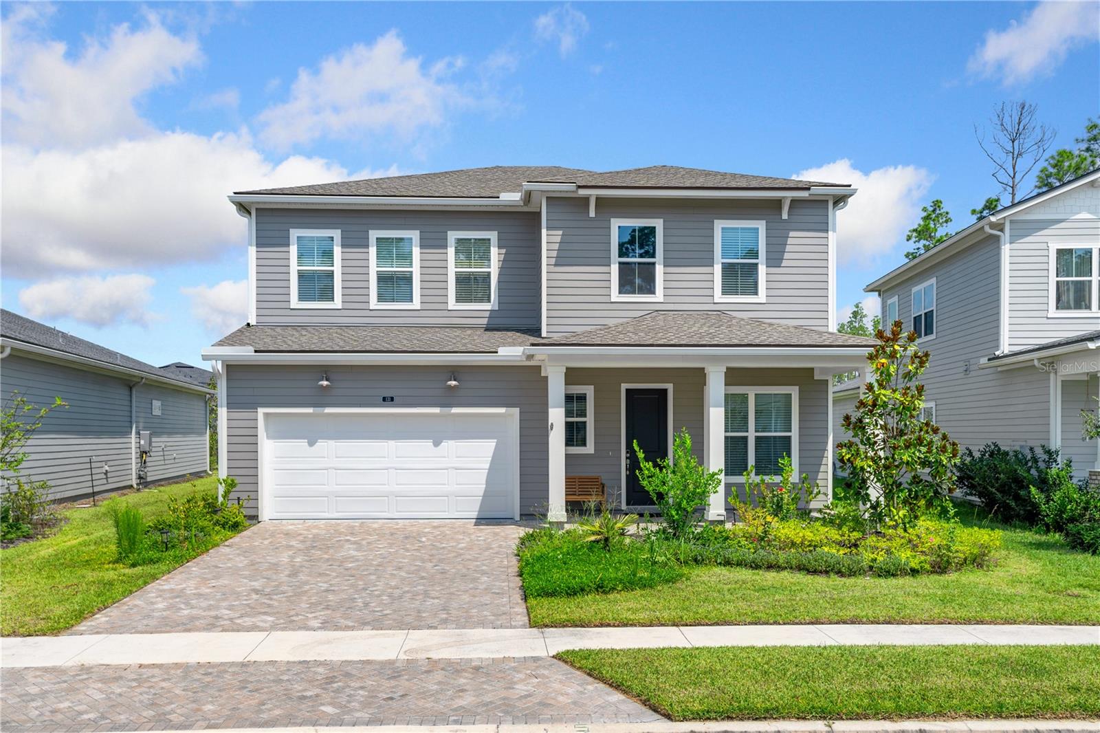 Welcome to 131 Valley Falls Way — a Toll Brothers masterpiece where sophistication meets comfort in the gated community of Mill Creek Forest. Experience the pinnacle of refined living in this stunning 4-bedroom, 3-bathroom home with office and loft, artfully designed in the sought-after school district of St. Johns County. With low HOA fees and no CDD fees, this home provides exceptional style, value, and lifestyle in one of Florida's most desirable neighborhoods. From the moment you arrive, the impressive two-story foyer and extended covered porch set the tone. The inviting entry leads to a bright flex room, opening to a spacious great room and casual dining area. The layout flows seamlessly to the gourmet kitchen — a chef's dream with custom cabinetry, stainless steel appliances, a large center island with breakfast bar, and plenty of storage. The kitchen is perfectly positioned for entertaining, with direct access to the main living areas and a covered patio overlooking a large, peaceful yard.
Special highlights include a secluded first-floor guest suite with full bath, a versatile home office, and an expansive loft upstairs offering additional living or entertainment space. The primary suite is a true retreat, featuring a spa-like bath with dual vanities, a luxe walk-in shower, oversized closet, and a private balcony with tranquil pond views perfect for morning coffee or evening relaxation. Three additional bedrooms with generous closets provide flexible options for family or guests.
The home's design emphasizes indoor-outdoor living, with glass doors opening onto a brick-pavered patio ideal for gatherings and enjoying Florida evenings. Practical features include a centrally located laundry room and abundant storage solutions throughout.
Community Lifestyle
Mill Creek Forest residents enjoy brand-new amenities, including a resort-style pool, clubhouse, fitness center, yoga room, tennis and pickleball courts, playground, and indoor/outdoor gathering spaces. The neighborhood offers the best of both worlds: a quiet, gated retreat with easy access to top-rated schools, shopping, dining, and major highways.
Schedule your private showing today!