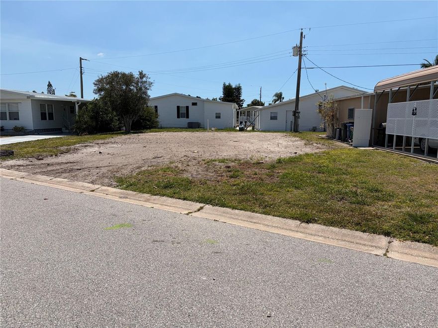 This cleared and vacant parcel is prepared for the installation of a new manufactured home. The lot measures 53 by 76 feet and is situated within the AE flood zone. Tri-par Estates is a 55+ community that provides a wealth of amenities: enjoy a heated and cooled large pool for year-round swimming, a brand-new spa, tiki hut, pickleball courts, fitness center, shuffleboard, miniature golf, horseshoes, and various recreation hall rooms equipped with ping-pong, billiards, card tables, a kitchenette, sewing areas, and more. The expansive clubhouse regularly hosts dinners, dances, and other events.
Situated only minutes from downtown Sarasota, you’ll have easy access to marinas, shopping, restaurants, museums, the world-renowned Siesta Key and Lido Key beaches, and Sarasota airport.
In this special park and recreation district, residents own their land directly, with no separate HOA fees—an annual fee of $1,648 is included in your property taxes. Internet and TV included in the annual fee This is also a golf cart-friendly community with optional RV or boat storage when available. Don’t miss the opportunity to join this lively, well-established neighborhood in paradise.